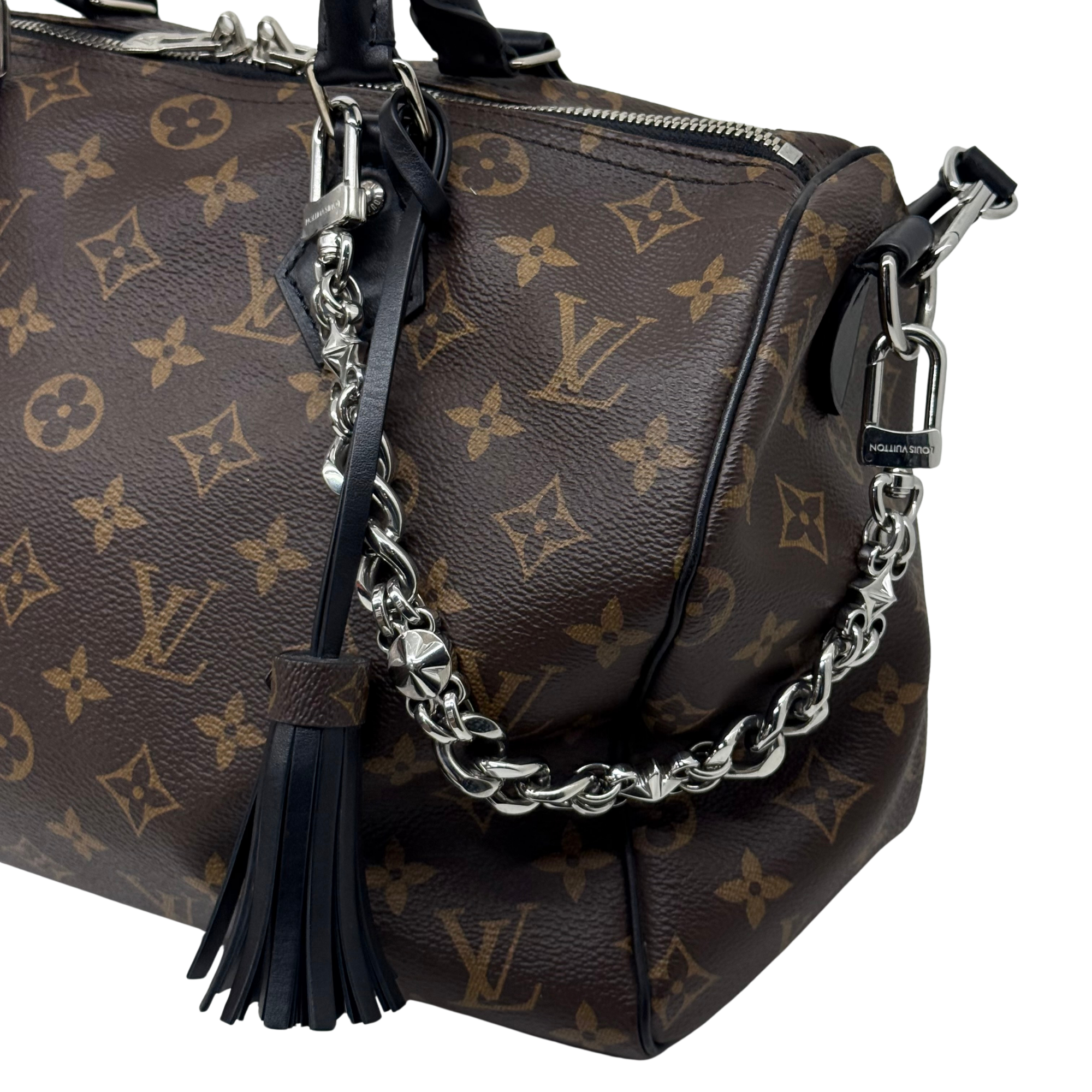 Pre-owned Louis Vuitton monogram handbag with chain strap, black tassel, top handles