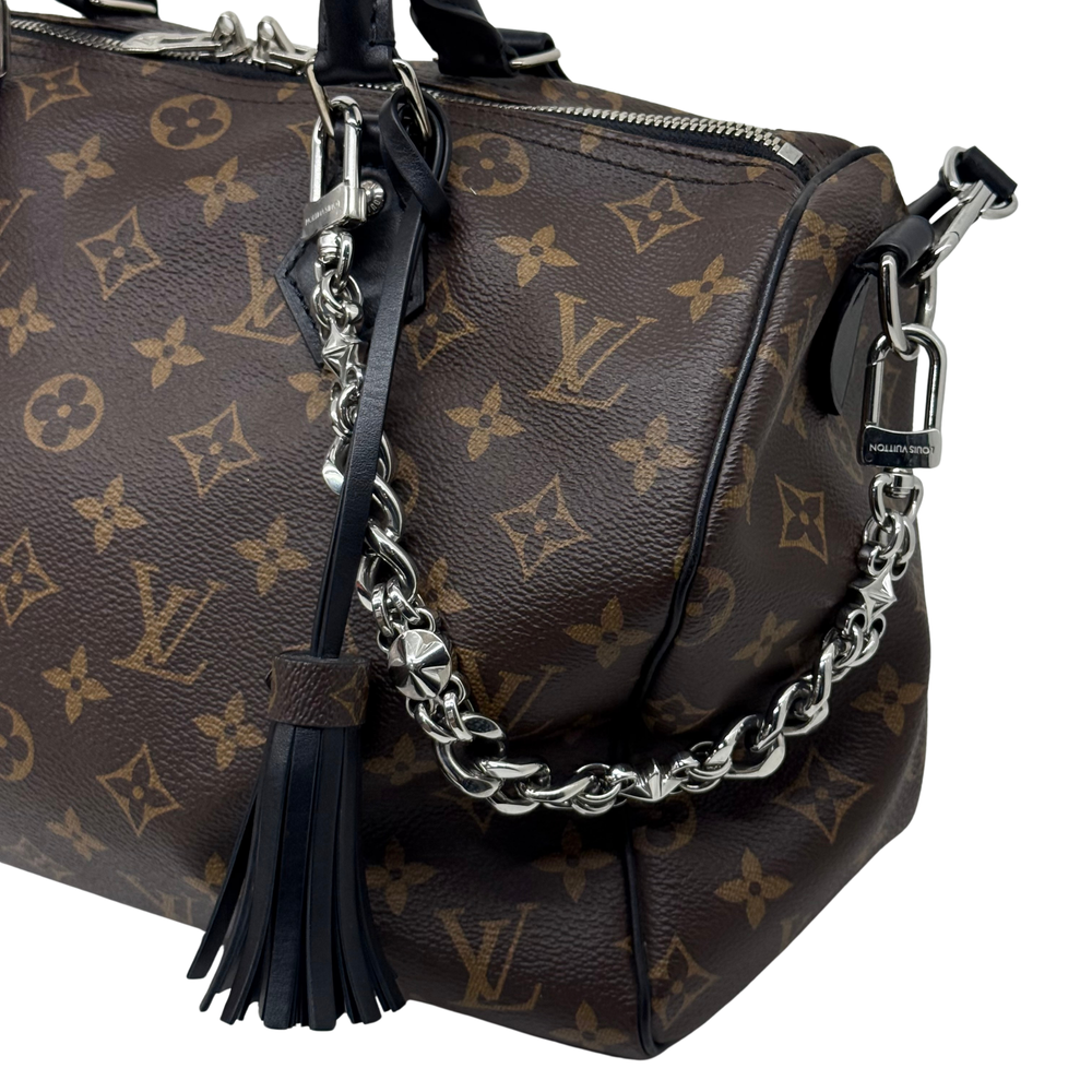 Pre-owned Louis Vuitton monogram handbag with chain strap, black tassel, top handles