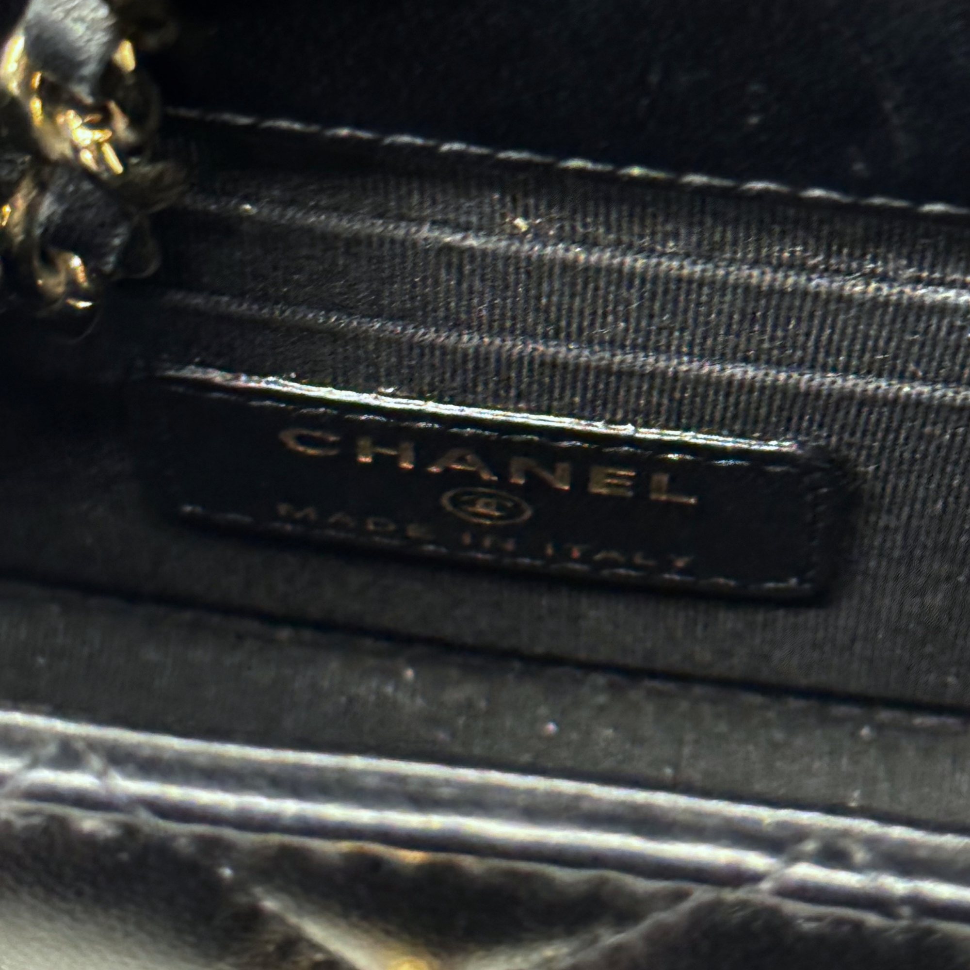 Black Chanel leather interior label and stitching on mini bag