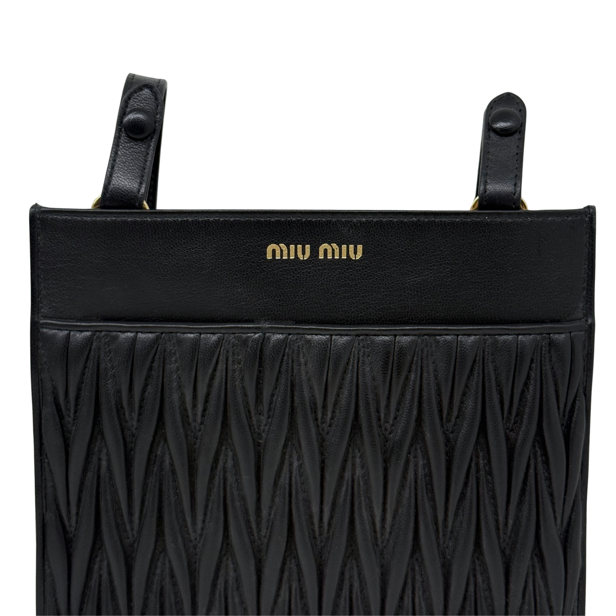 Black leather mini bag with top handles, Miu Miu logo, and textured front