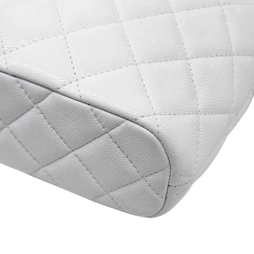 Chanel quilted white bag base corner with rounded seams and textured leather
