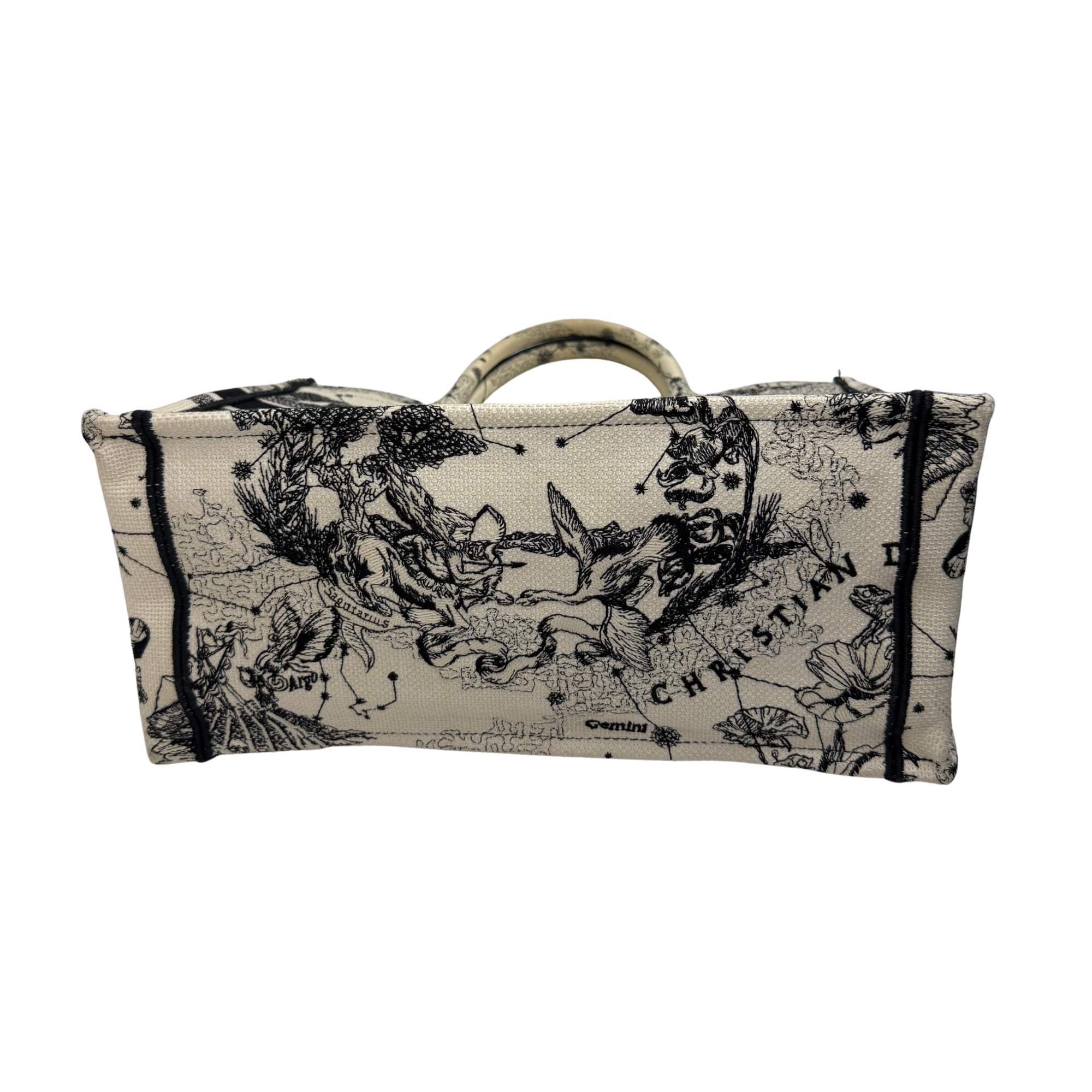Dior canvas tote bag with wide top opening and black floral graphic on beige base
