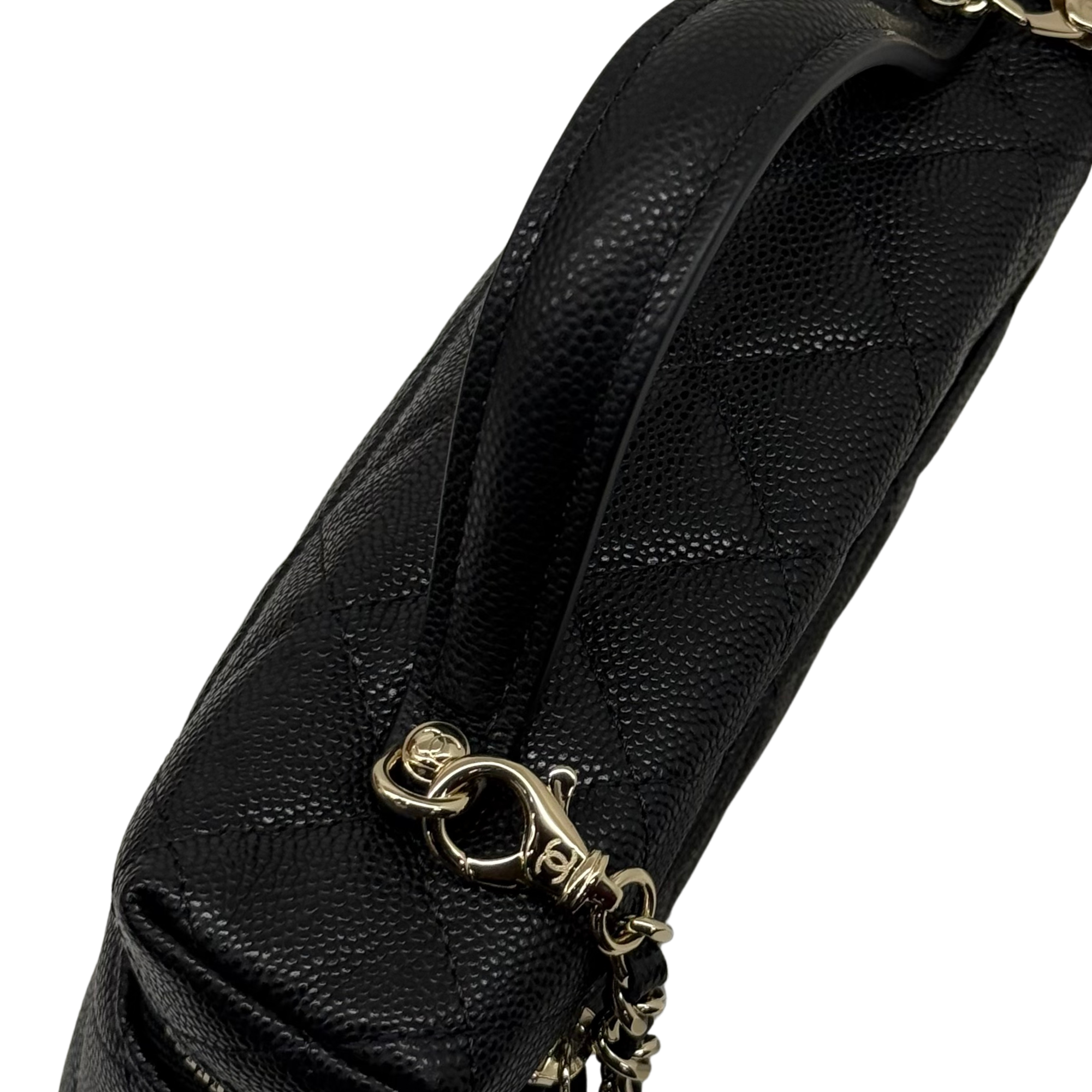 Black quilted Chanel crossbody bag with gold chain and CC logo charm