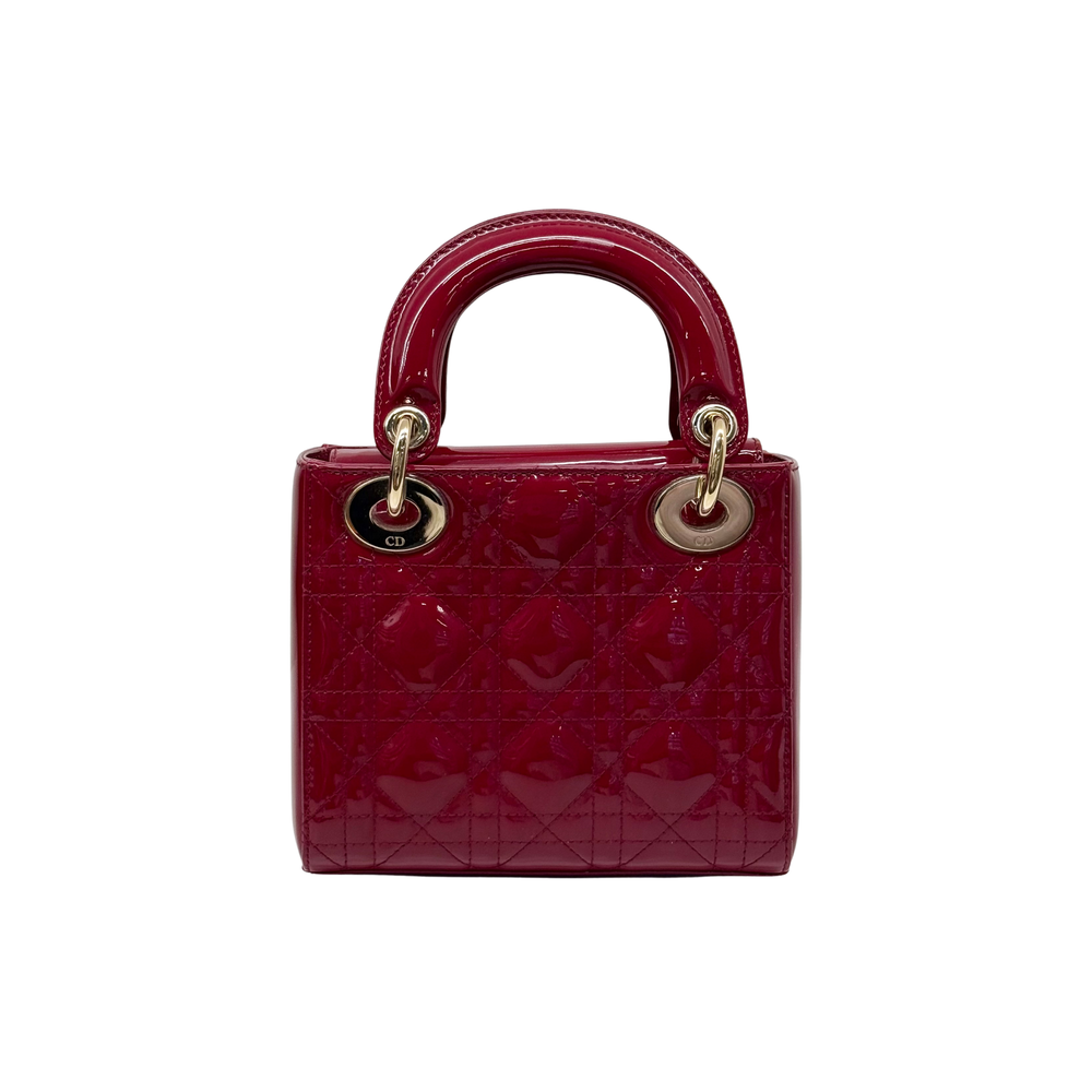 Red quilted patent mini handbag with gold top handles