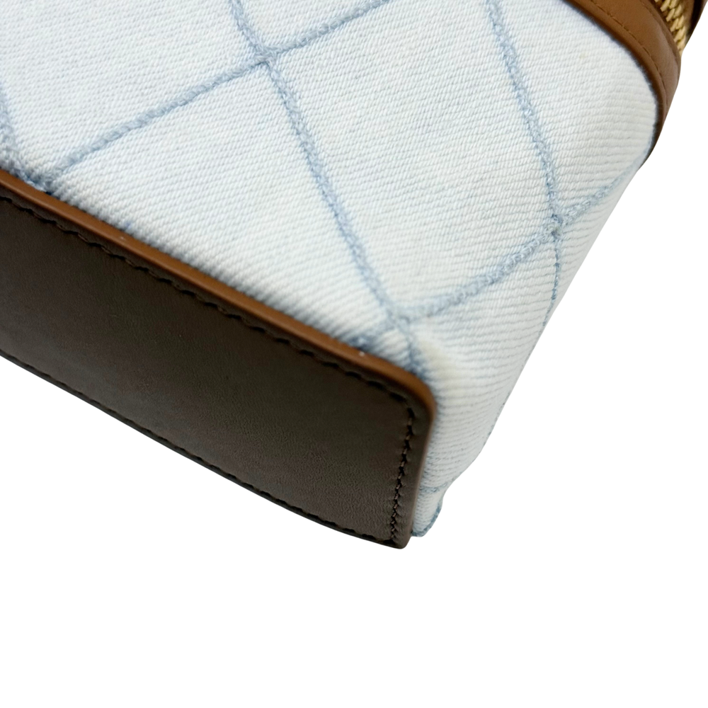Chanel light-blue quilted fabric and brown leather trim with stitched corner seam