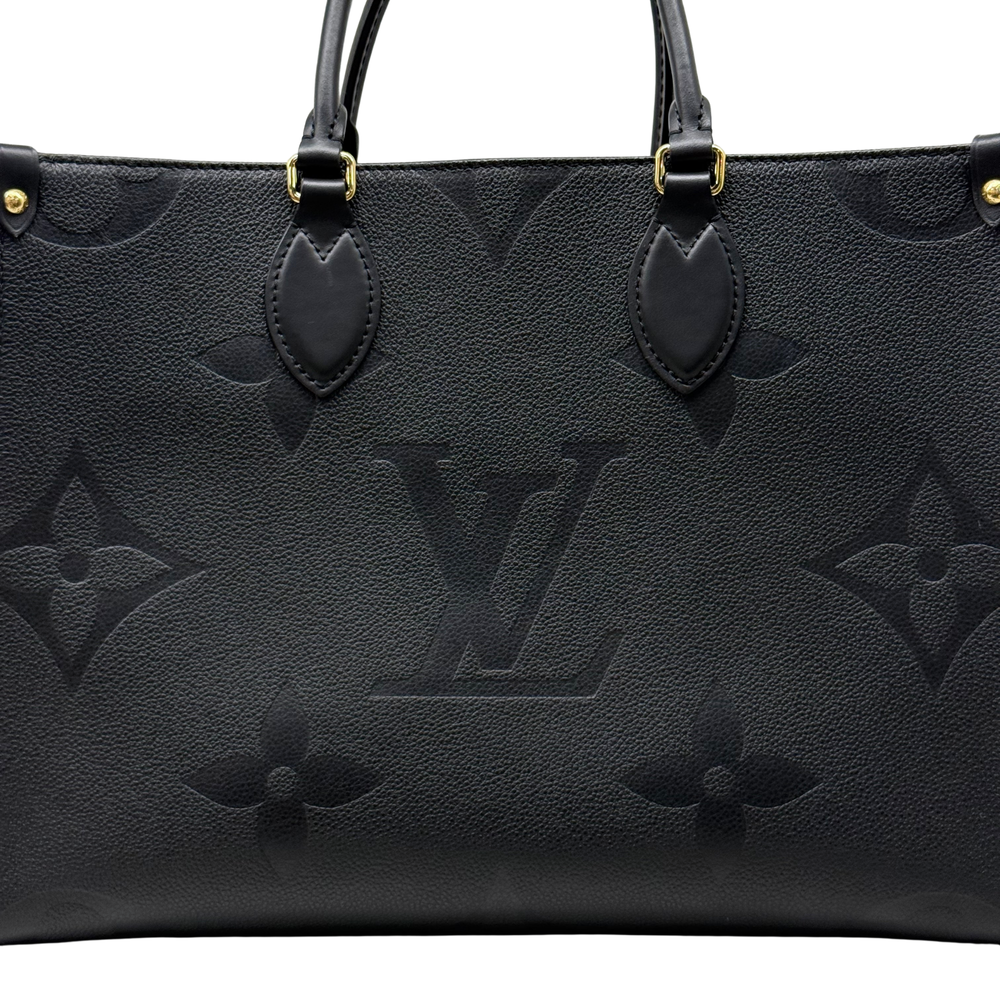 Louis Vuitton black monogram top panel with two handle attachments and embossed logo