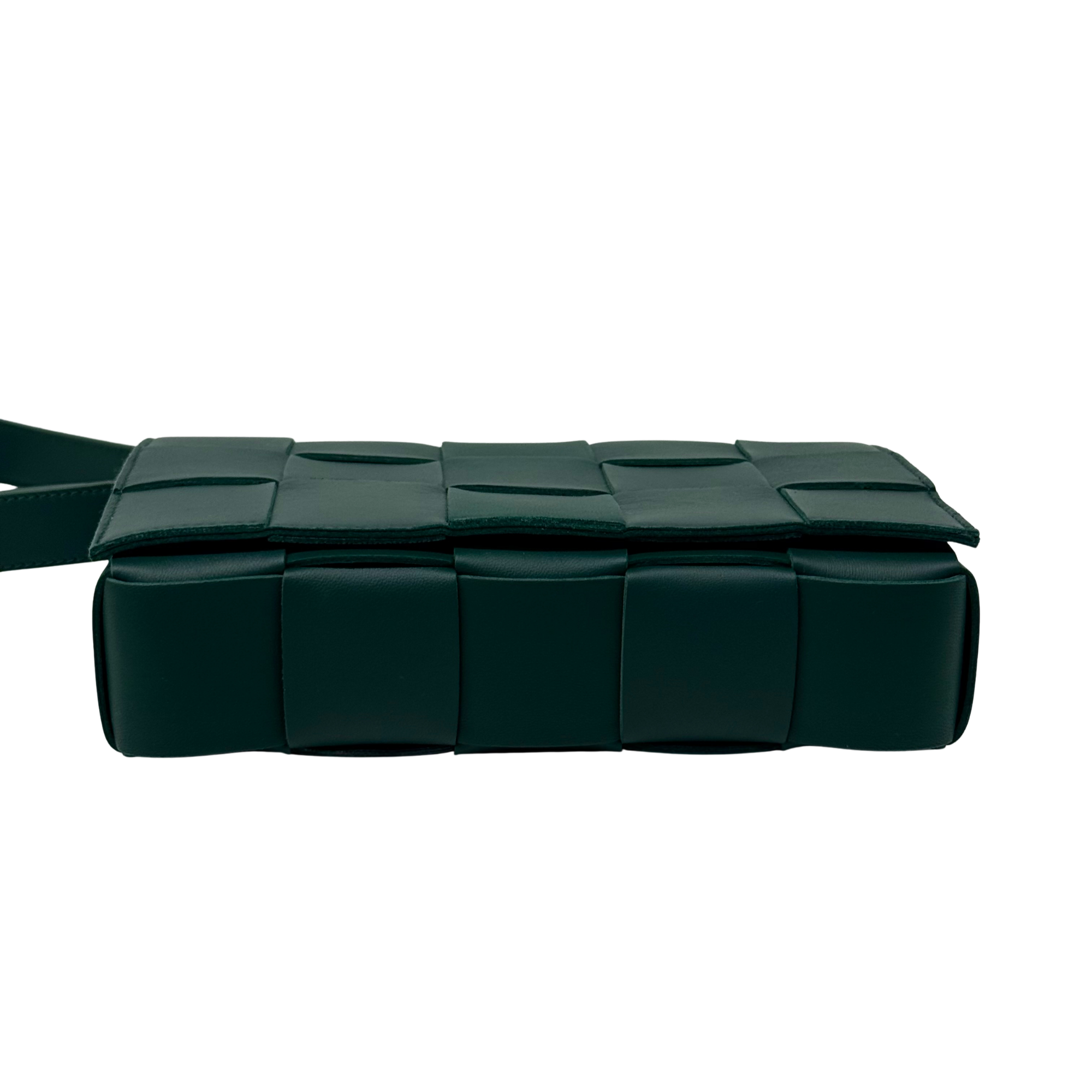 Green quilted leather bag with braided handle and woven front panels