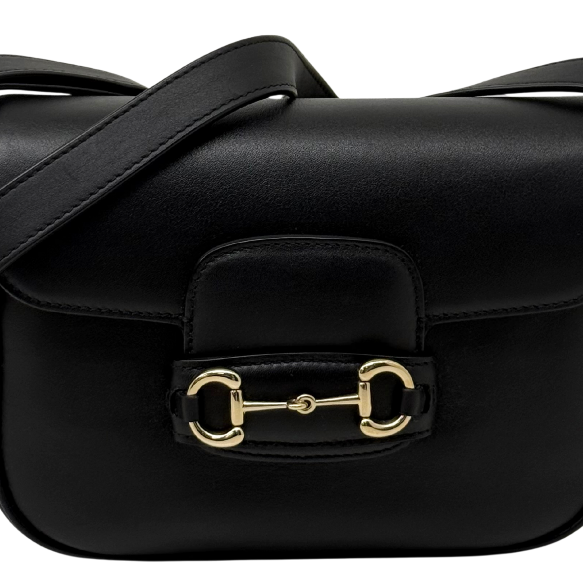 Gucci black leather flap bag front with padded panel and gold-tone clasp hardware