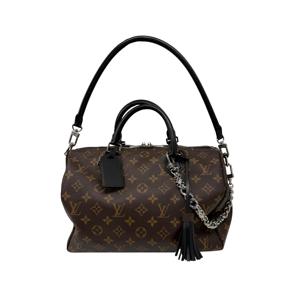 Pre-owned Louis Vuitton monogram handbag with chain strap, black tassel, leather handles