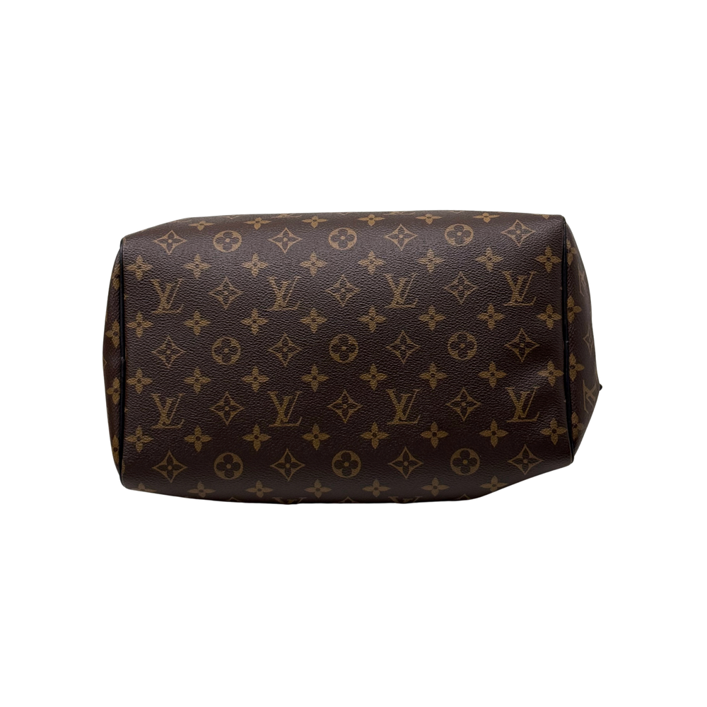 Louis Vuitton pre-owned monogram duffel bag with rounded shape and structured sides