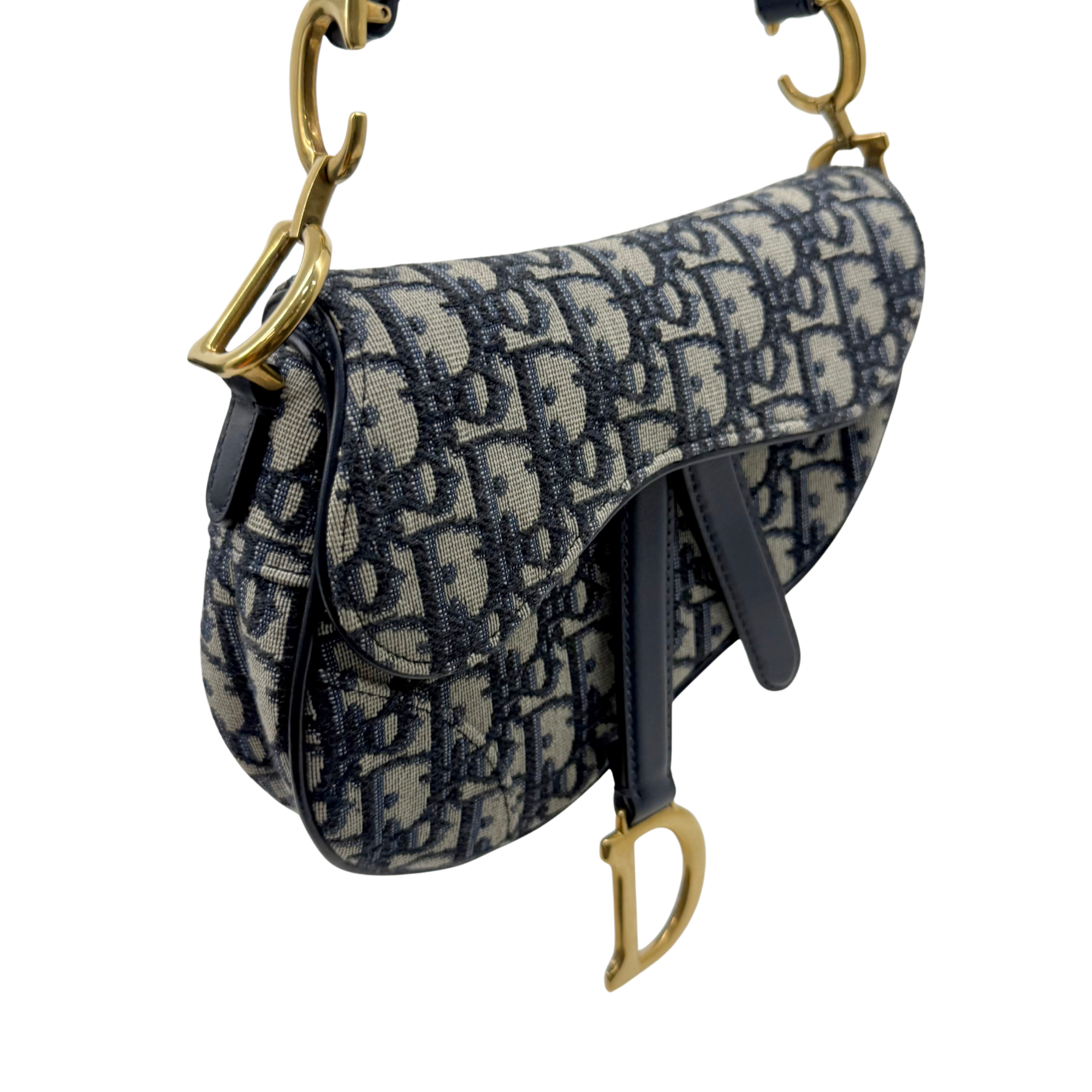 Dior monogram crossbody bag detail, flap front and navy pattern, gold-tone rings