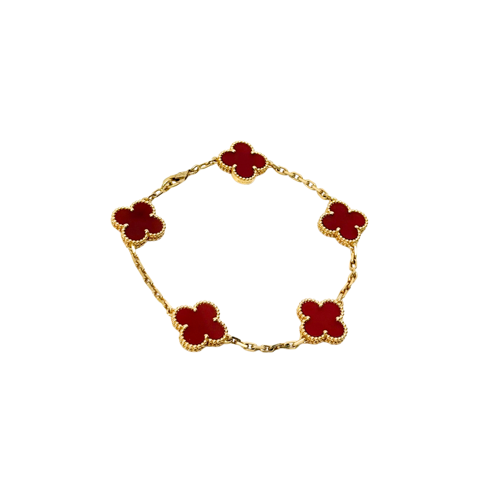 Goldtone bracelet with five red clover links, full circular shape