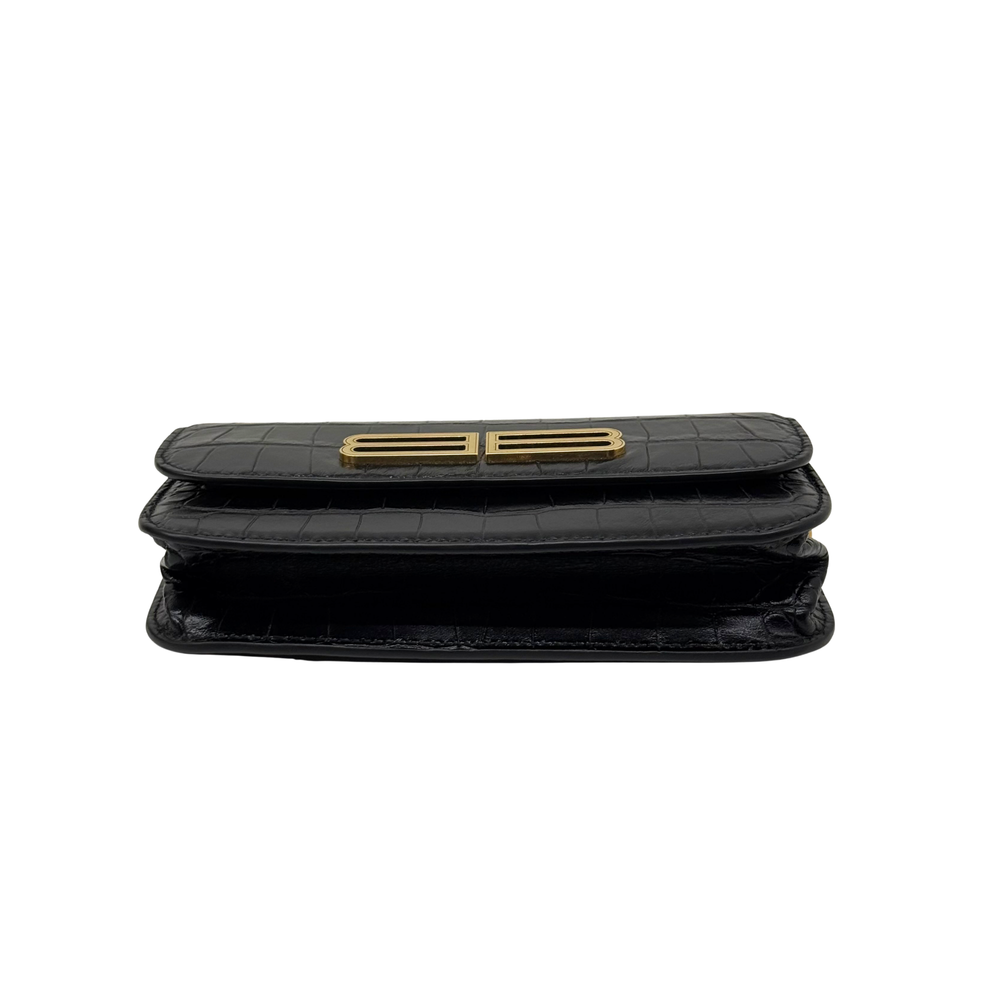 Black croc-embossed leather shoulder bag with gold B logo on flap, flat stacked view.