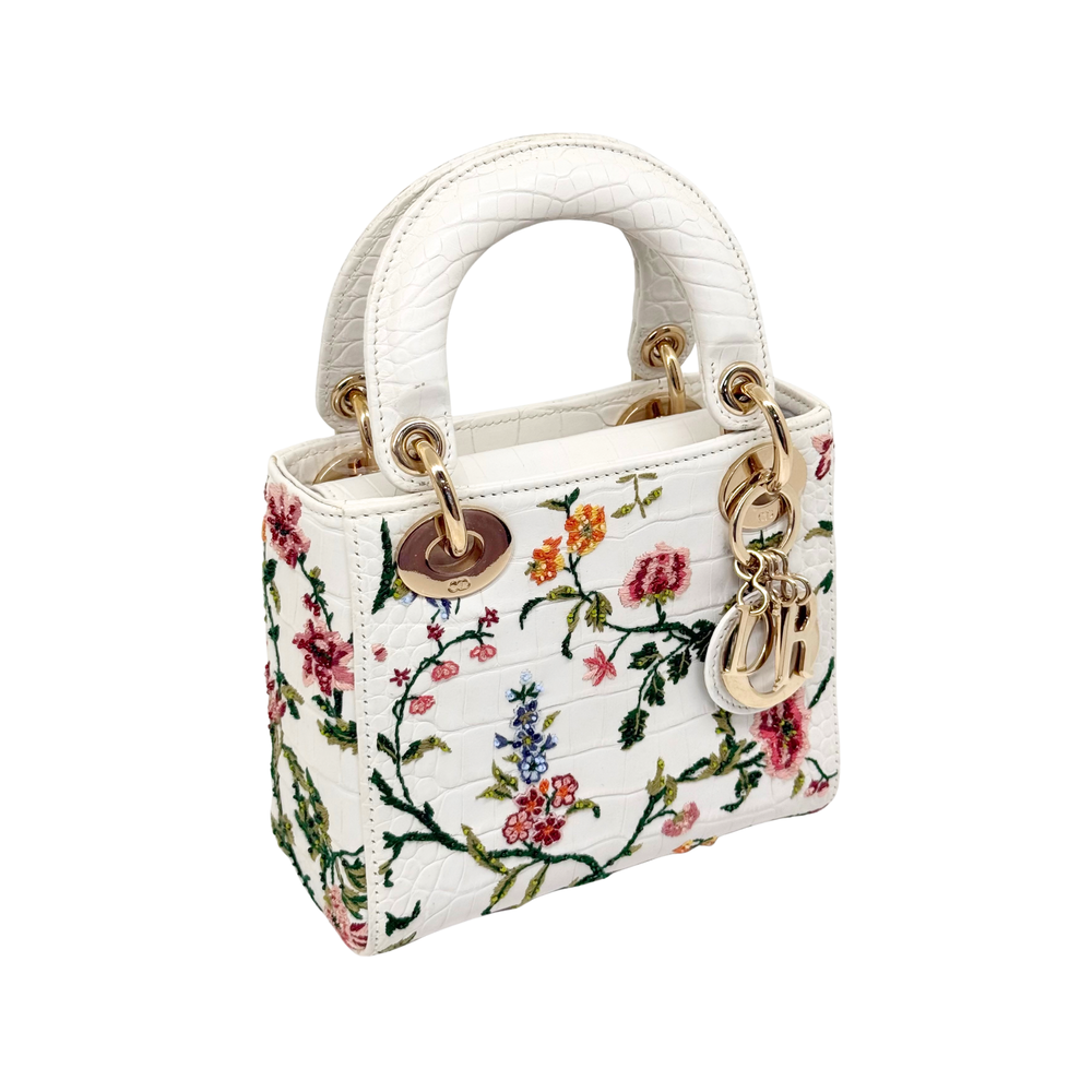 Pre-owned Dior mini handbag with white leather, floral pattern, gold top handles and clasp