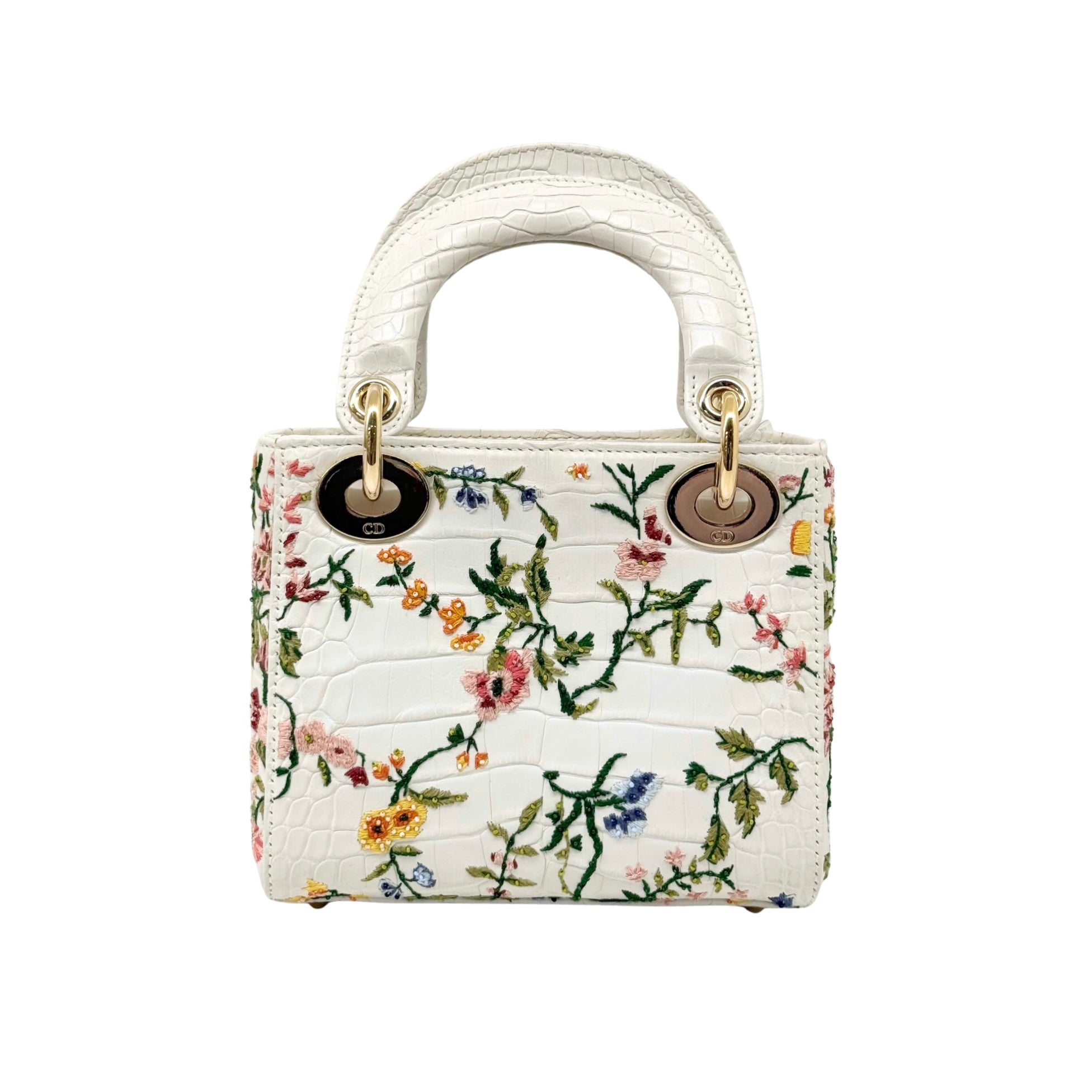 White floral mini handbag with top handles and gold ring attachments