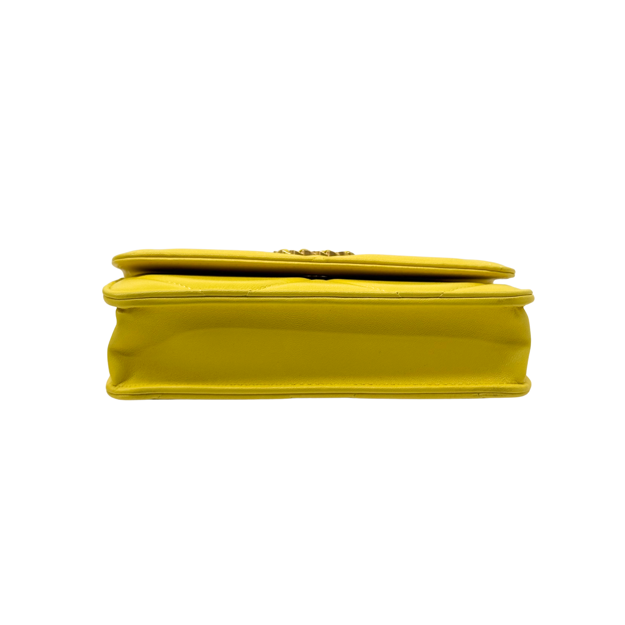 Yellow leather mini bag with folded profile and top edge stitching