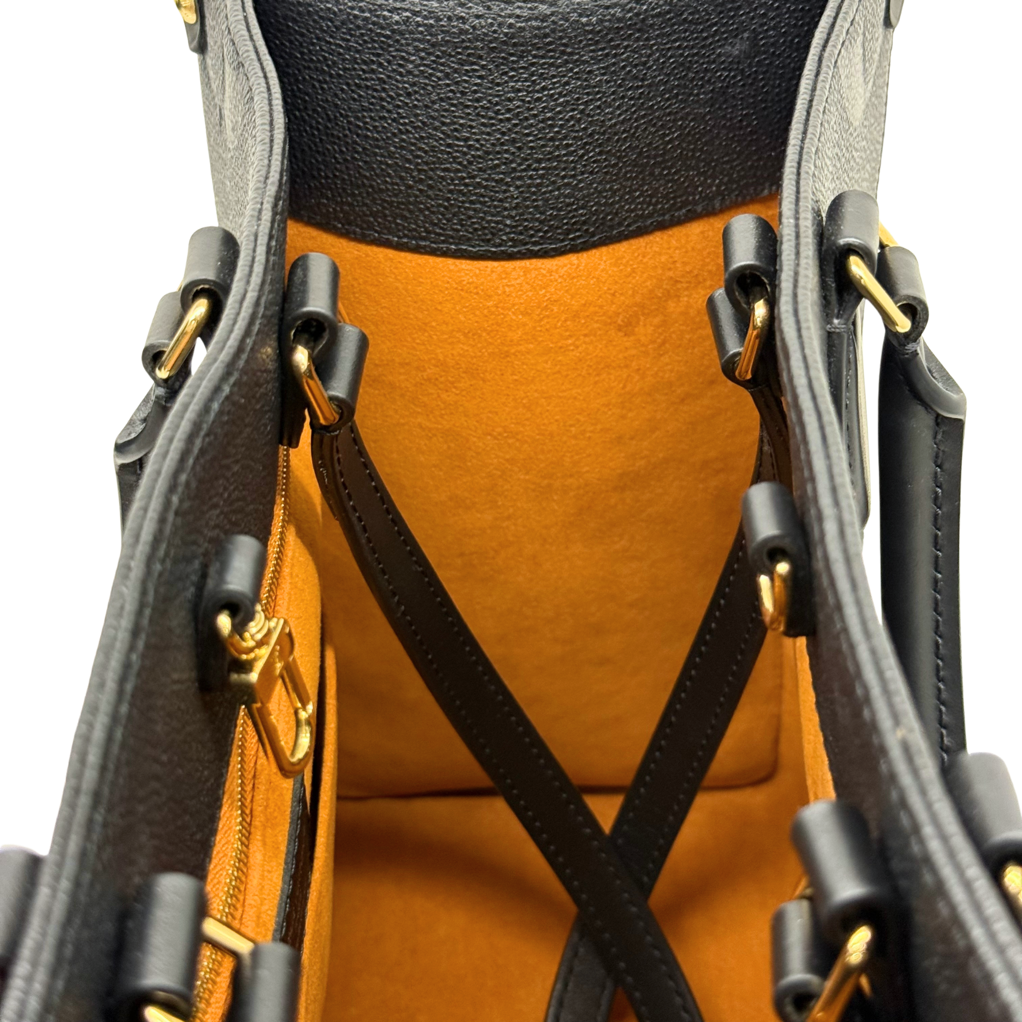 Louis Vuitton tote bag with crossed black strap detail and tan interior base