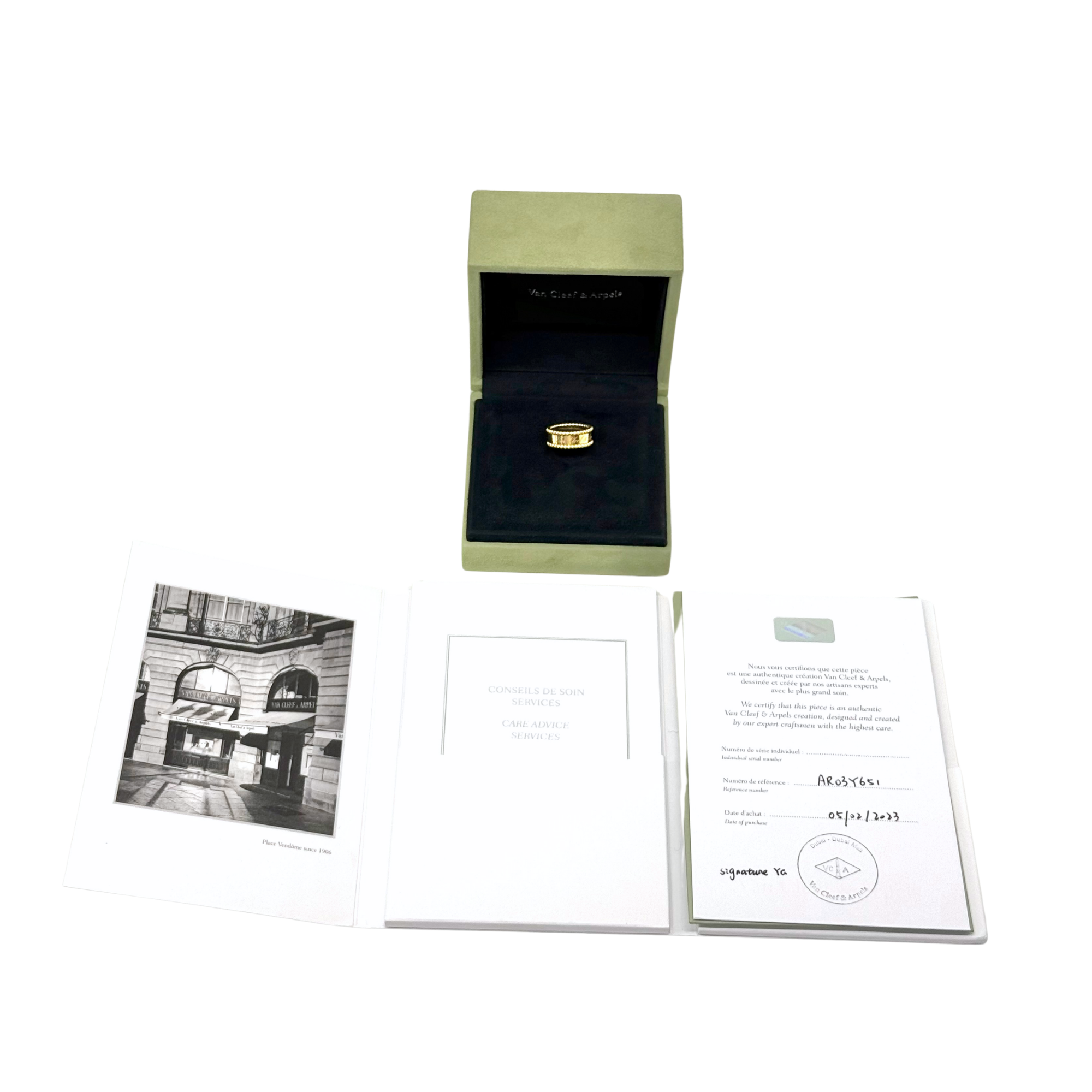 Gold-tone Van Cleef & Arpels ring in open box with certificates