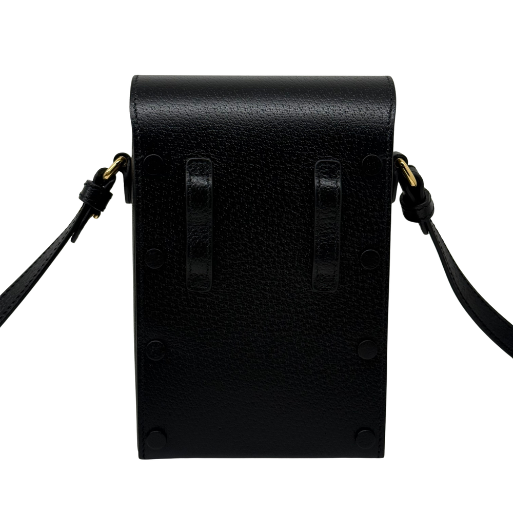 Gucci black leather mini crossbody bag back panel with embossed logo and straps