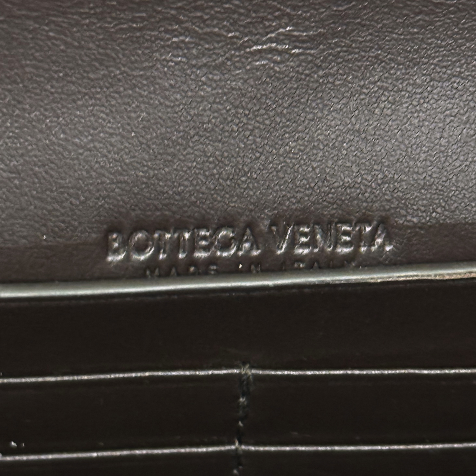 Bottega Veneta leather bag logo plaque on dark brown interior
