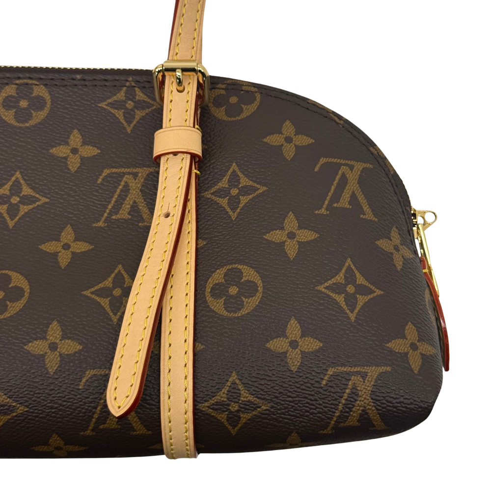 Louis Vuitton pre-owned monogram barrel bag detail, tan strap and zipper pull on dark brown