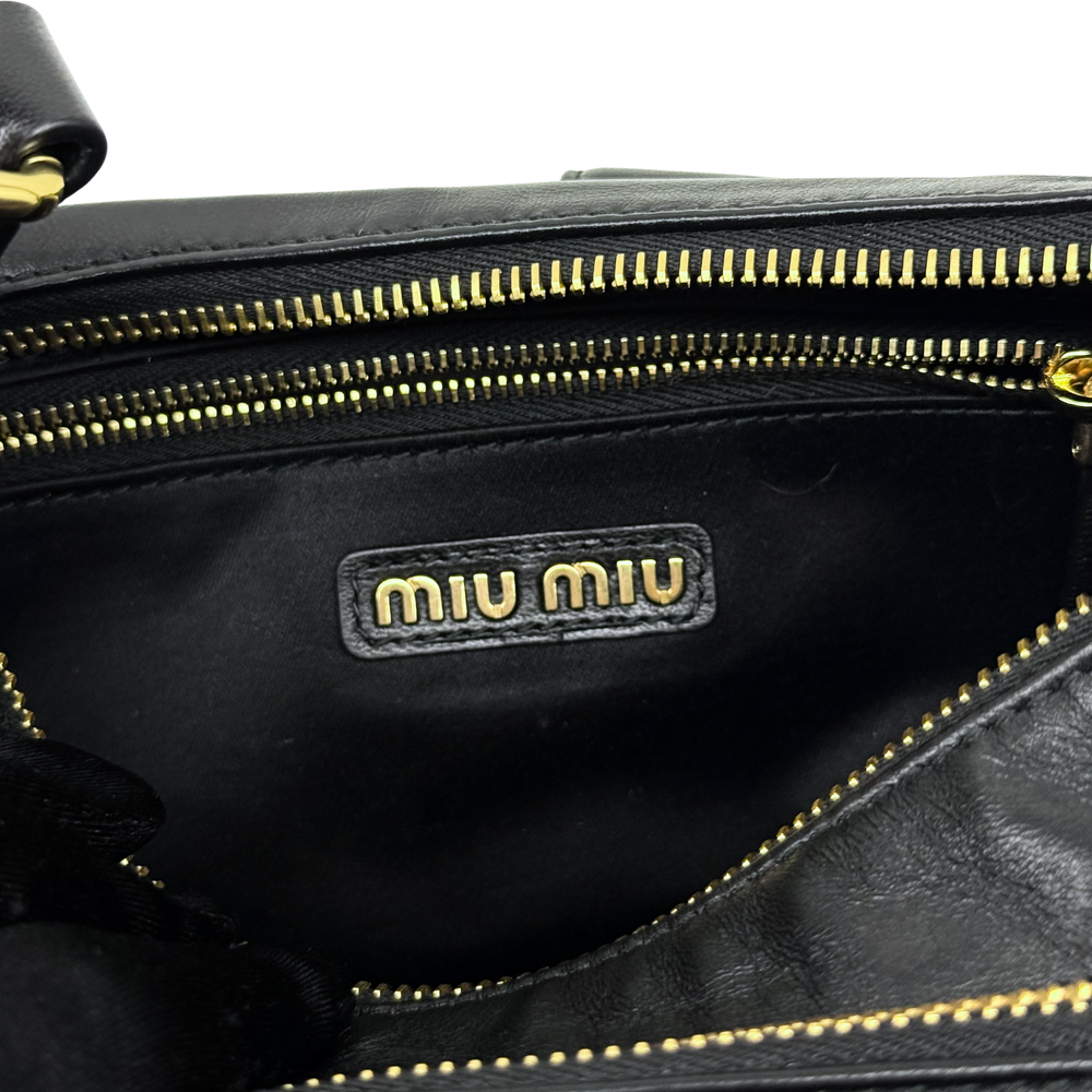 Pre-owned Miu Miu black leather shoulder bag with gold zipper and logo label inside