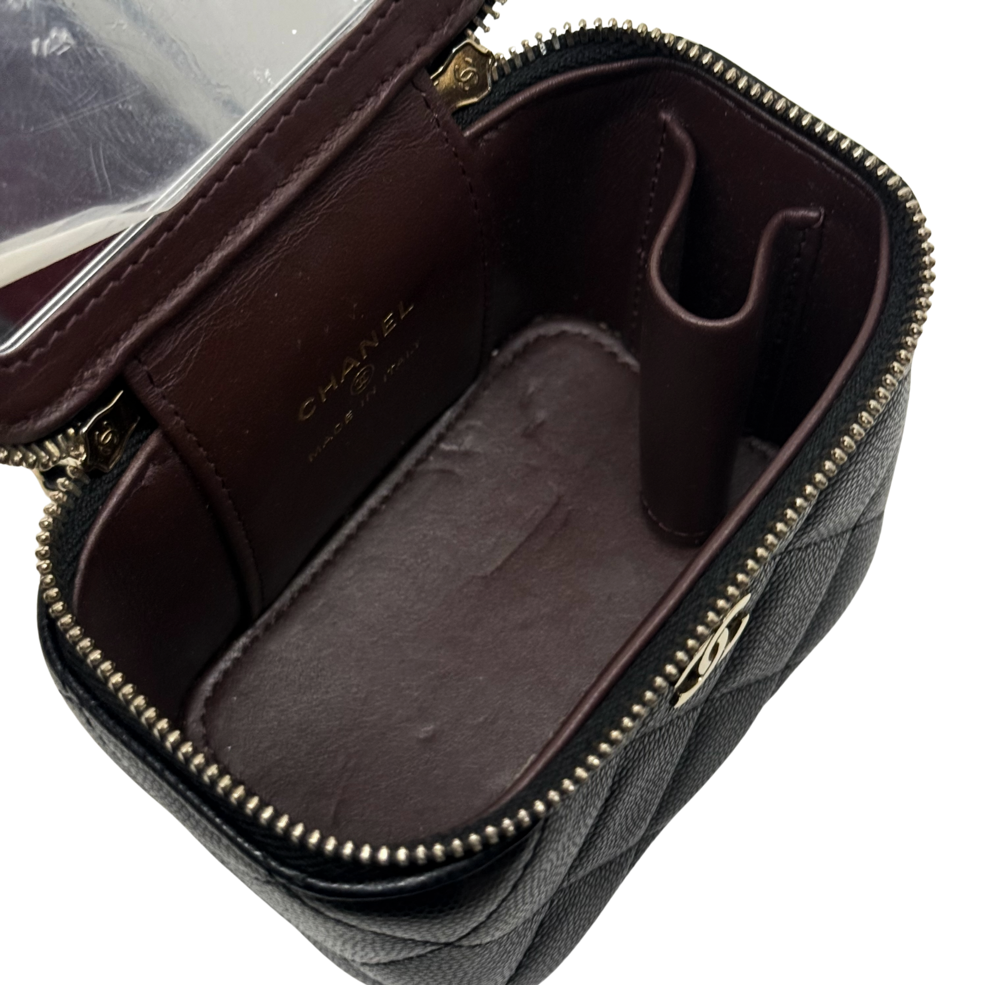 Pre-owned Chanel mini pouch open with burgundy card slot and logo lining