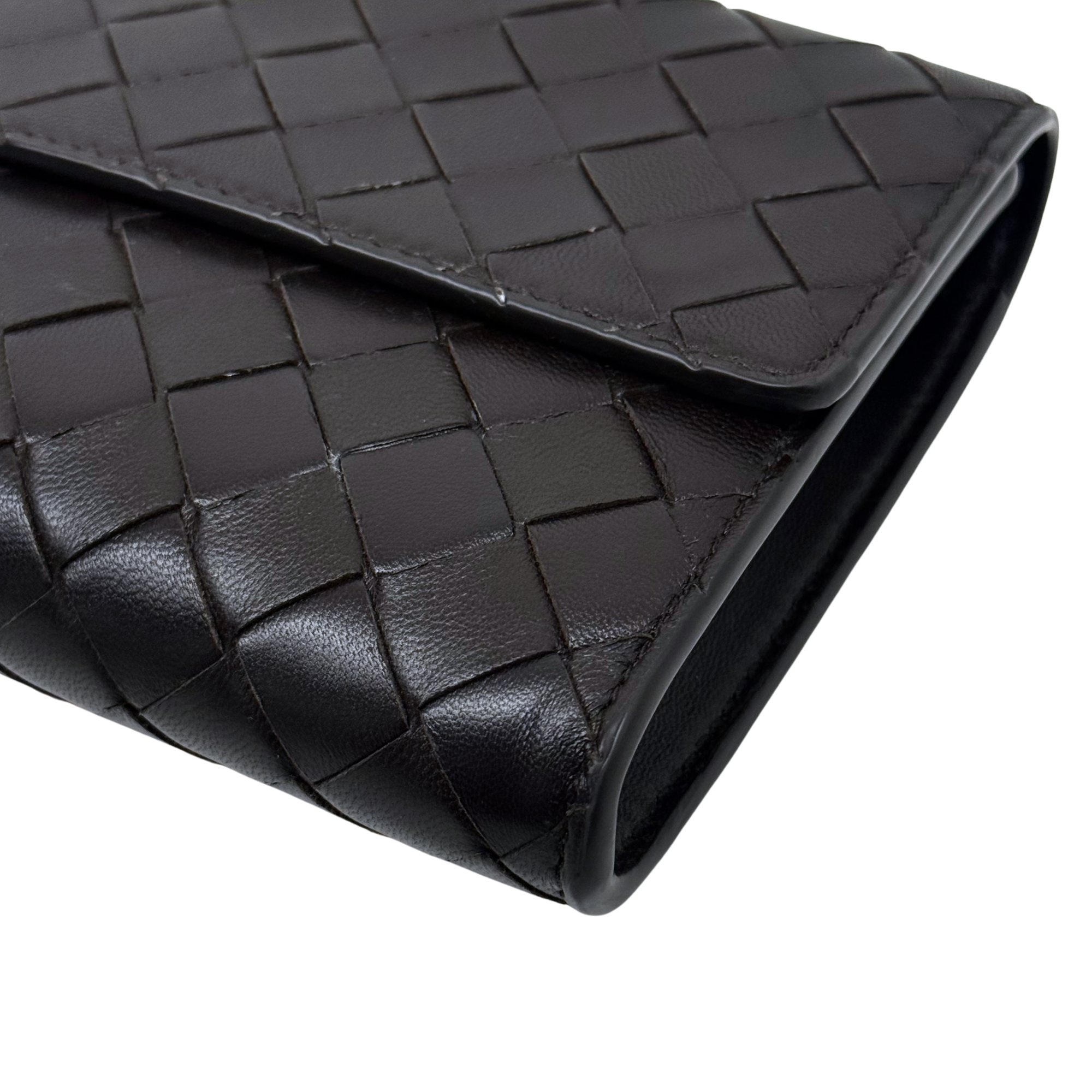 Black woven leather side panel with clean stitched borders