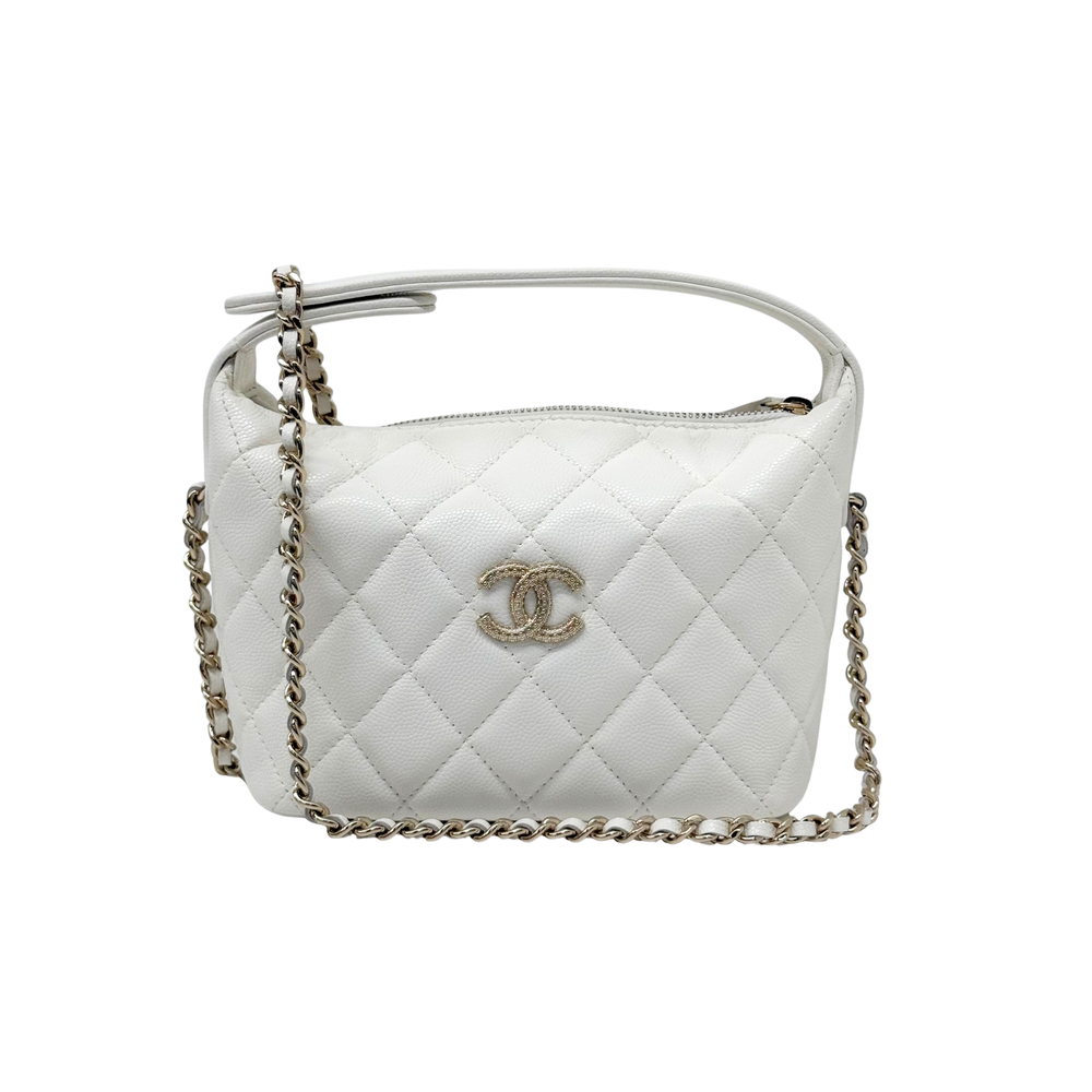 White quilted leather shoulder bag with chain strap, top handle, and Chanel CC logo