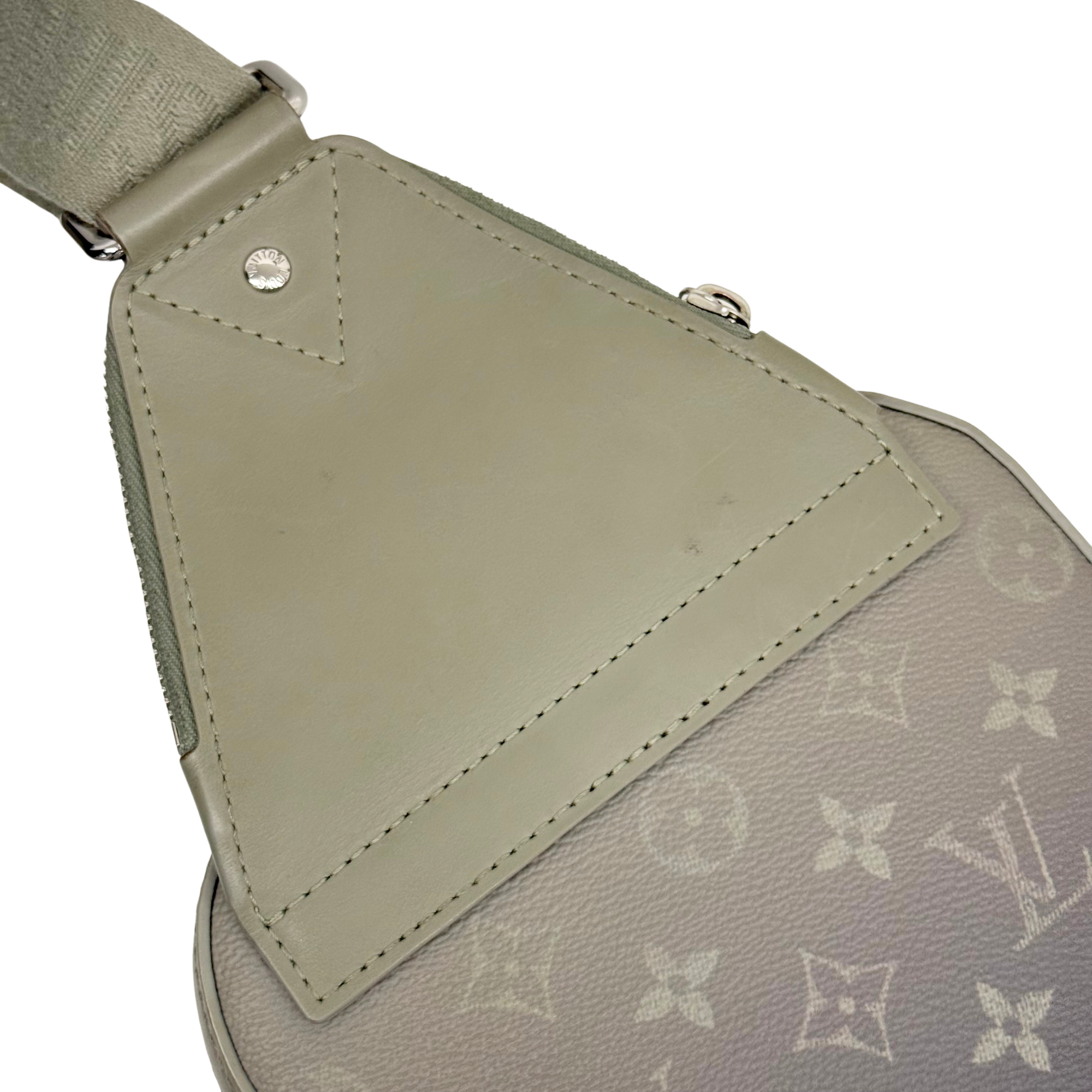 Pre-owned crossbody bag front flap with monogram pattern and stitched leather panel