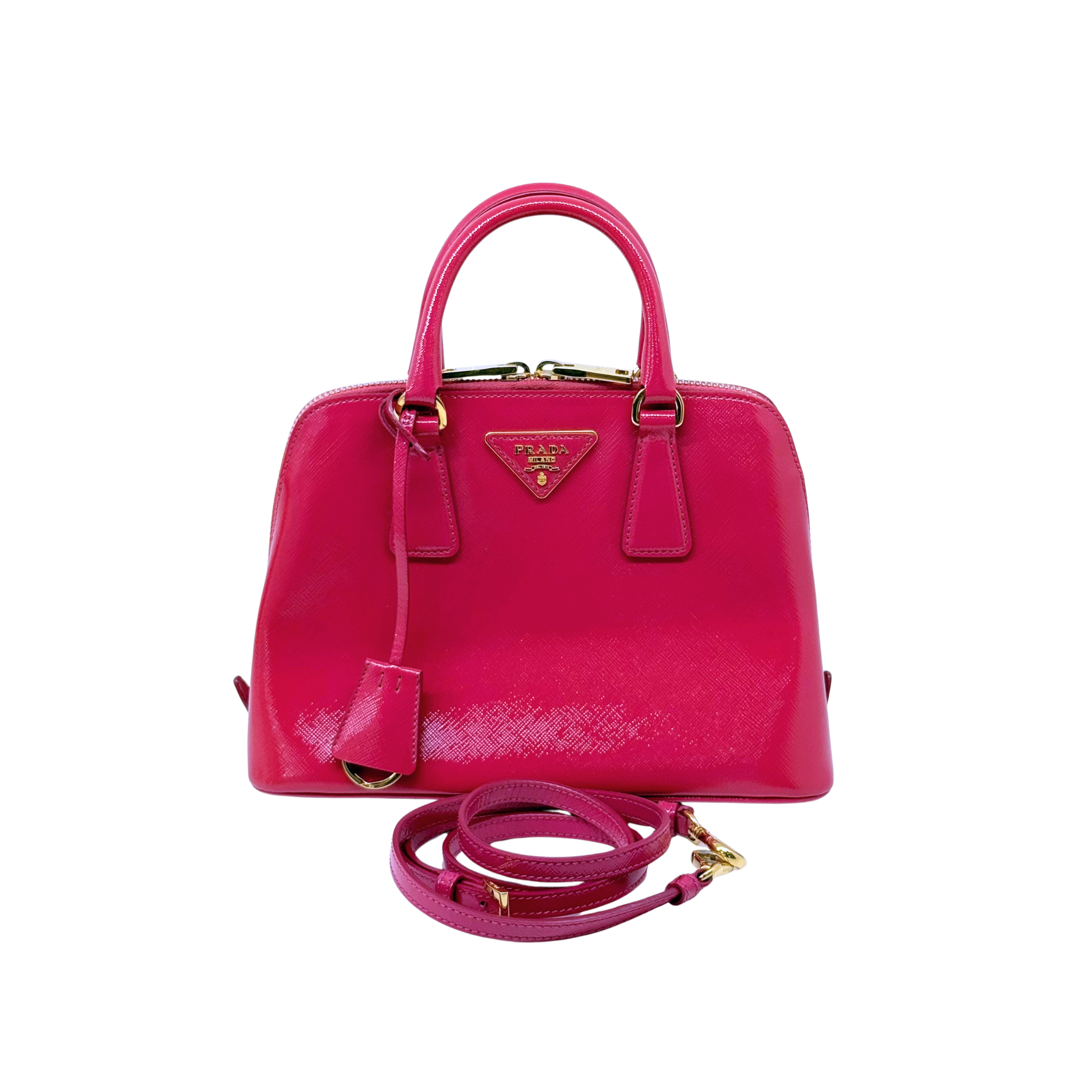Prada pink dome handbag with top handle and crossbody strap, gold-tone hardware
