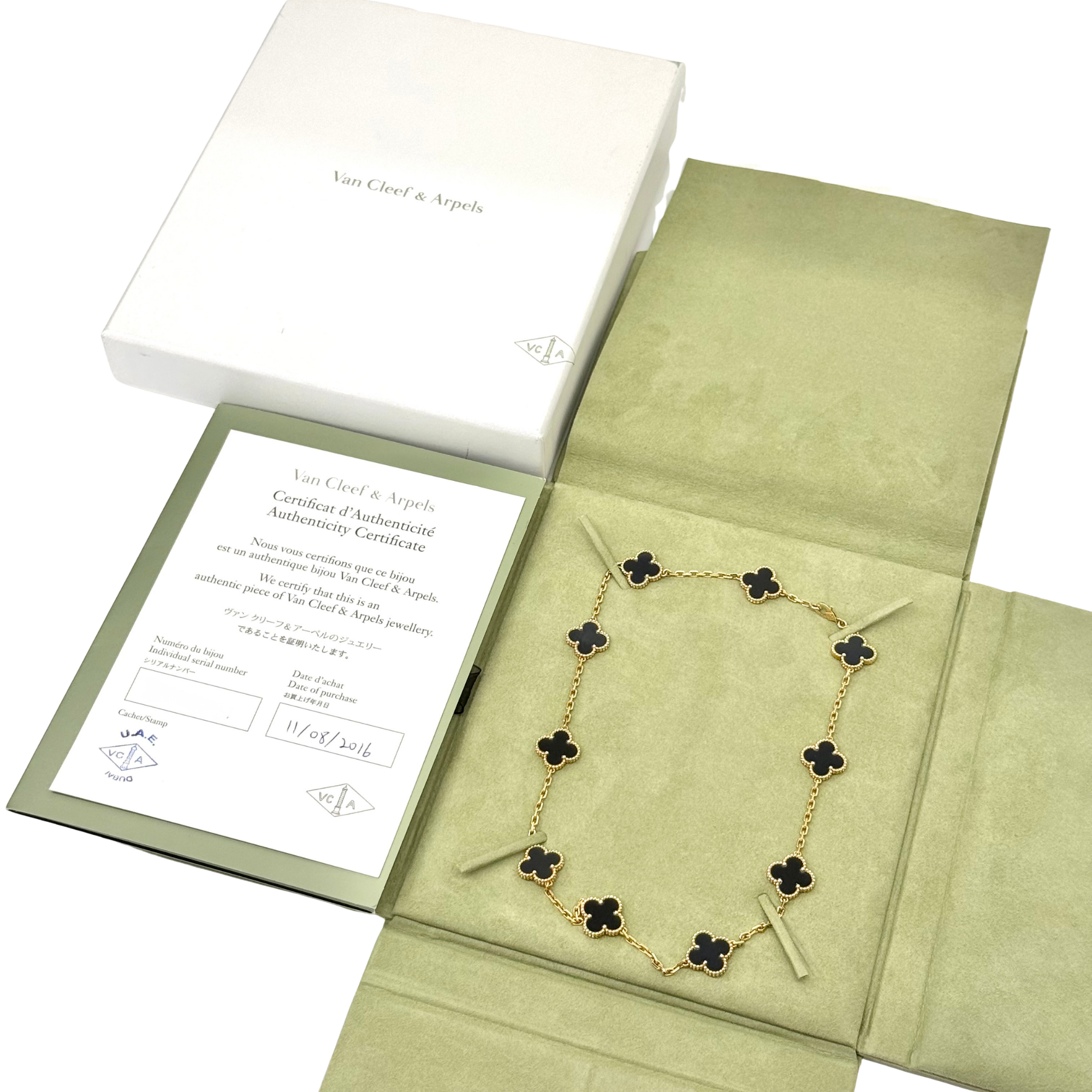 Van Cleef clover necklace in presentation box with gold-tone chain and black motifs