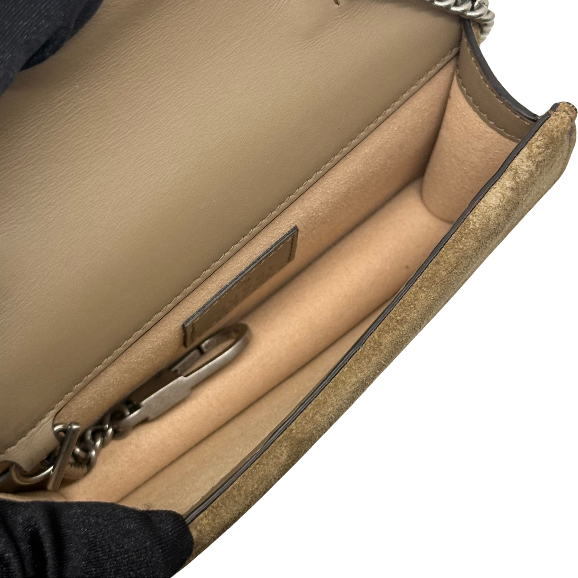 Gucci shoulder bag interior with tan lining and compartment, silver-tone chain strap