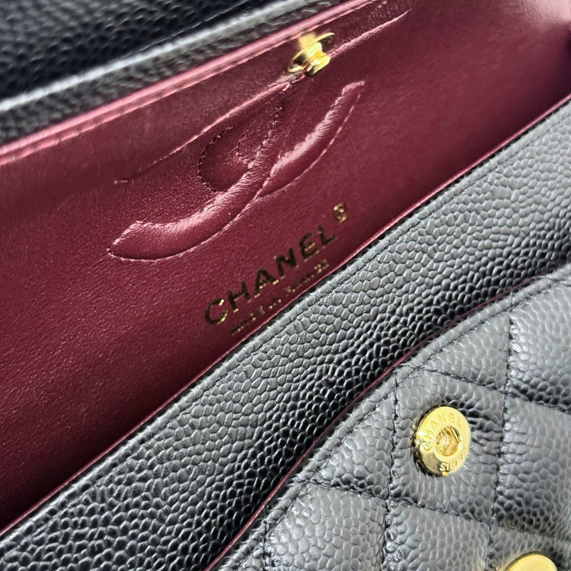 Chanel black bag caviar leather gold hardware