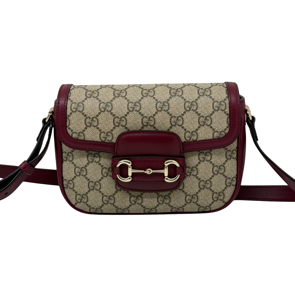 Burgundy leather strap GG monogram crossbody bag with front buckle