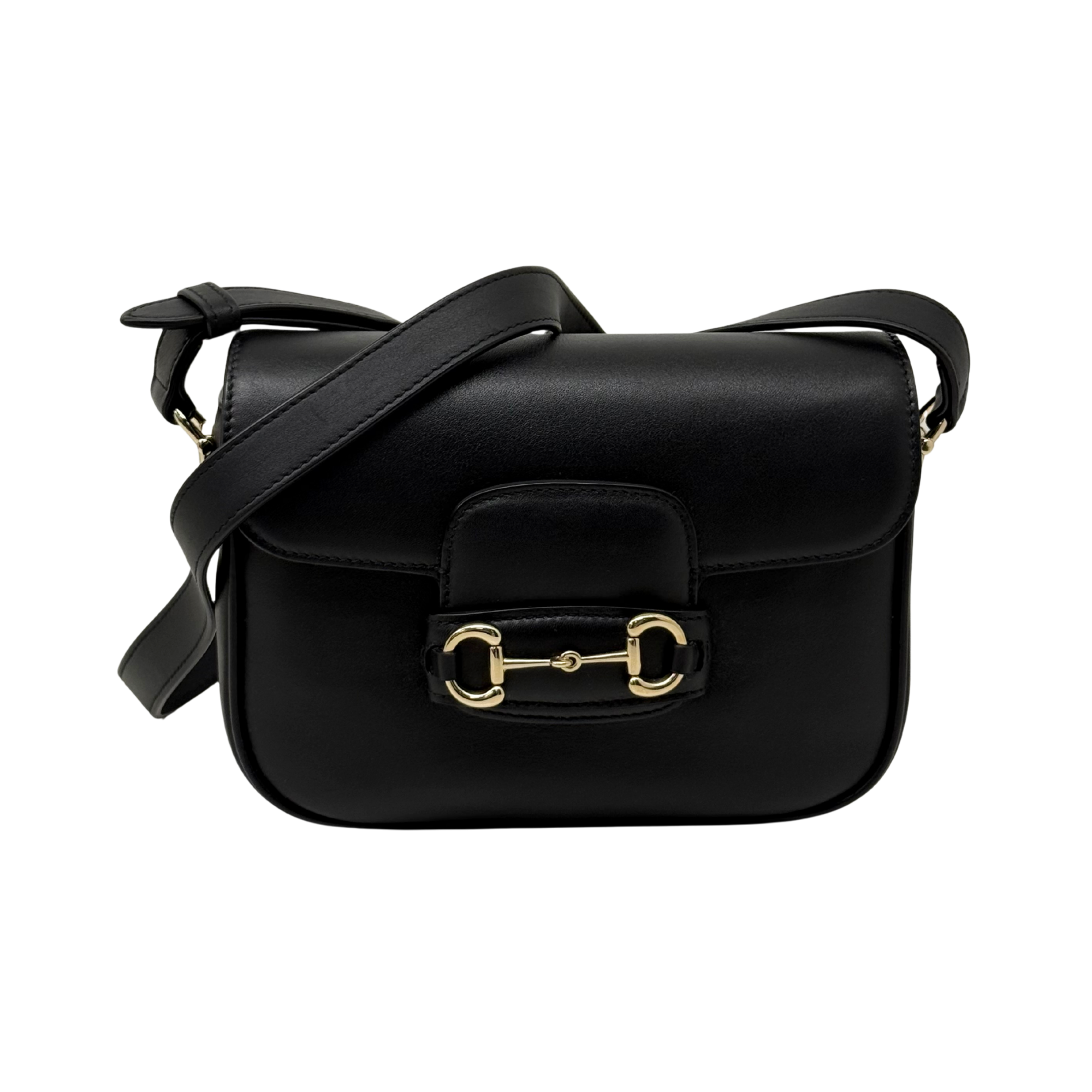 Gucci black leather small crossbody bag with flap closure and adjustable strap