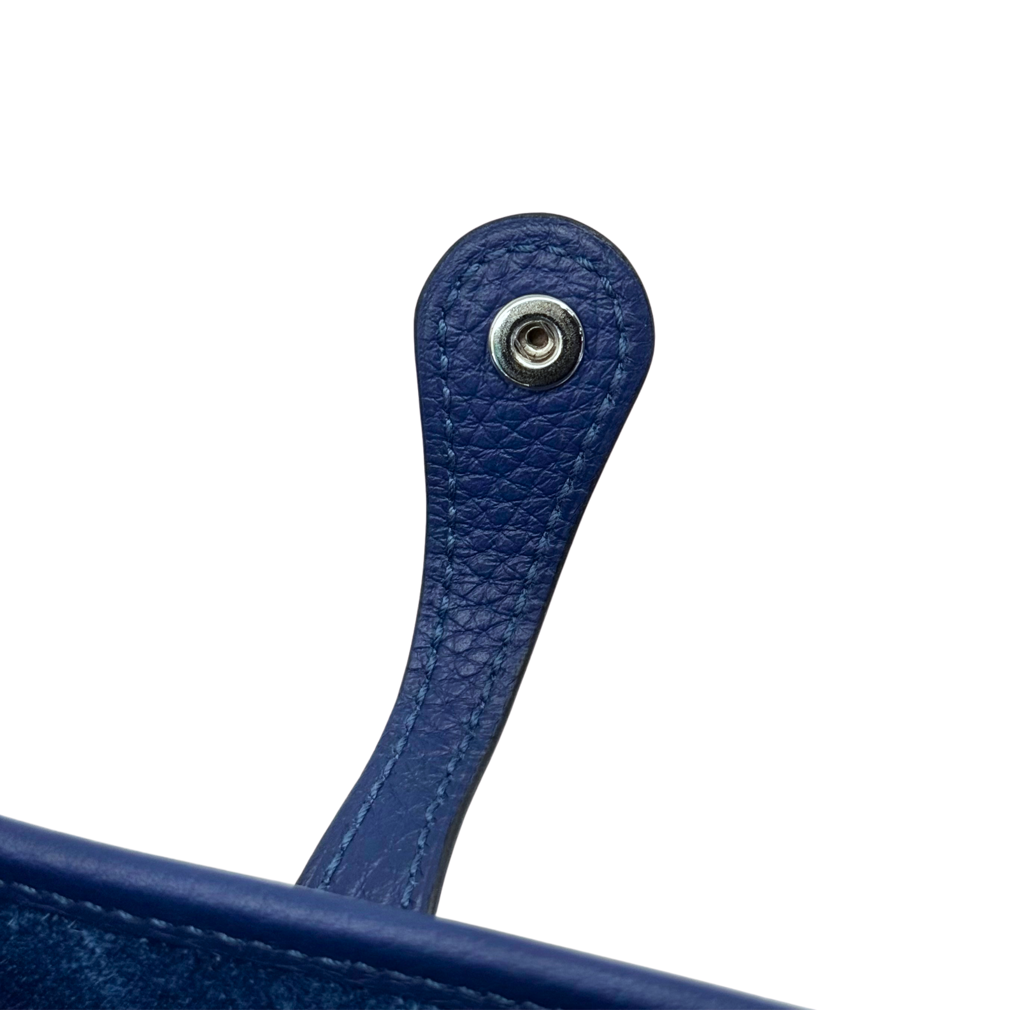 Navy leather crossbody strap with metal button and circular hardware detail