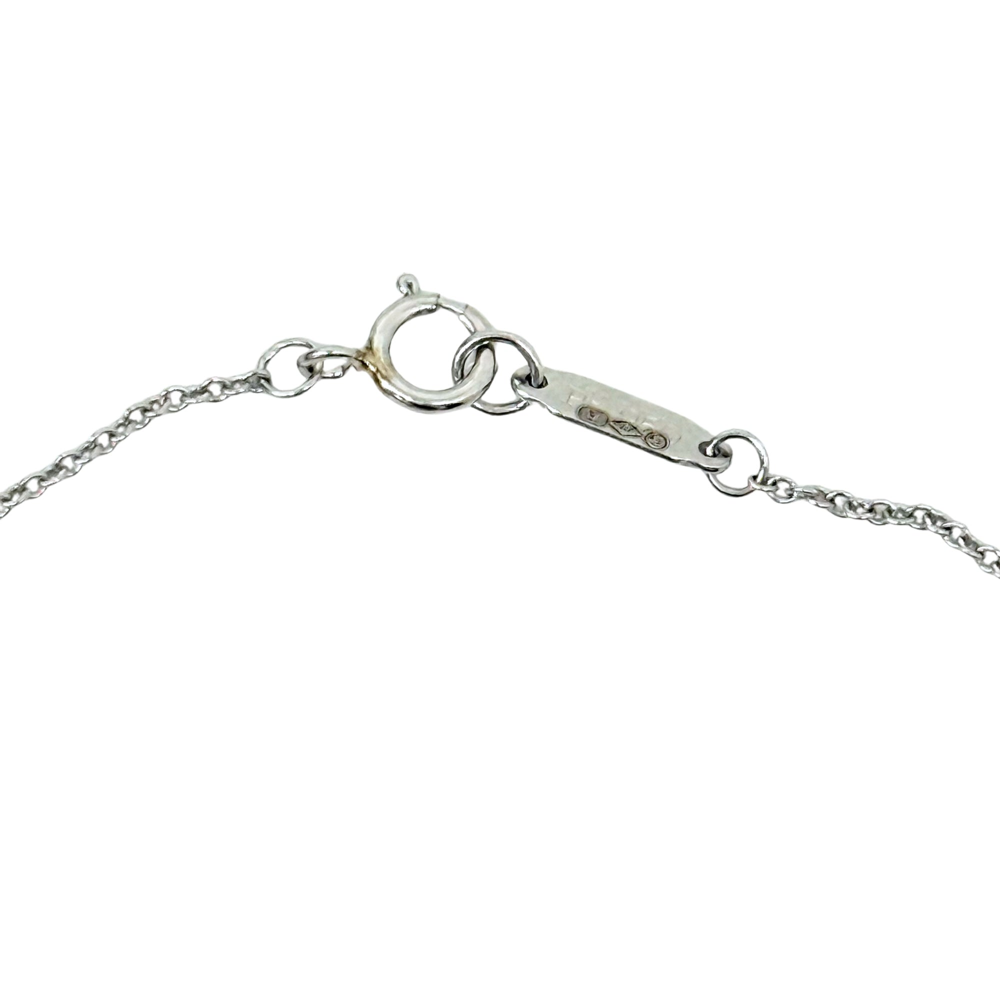 Silver-tone necklace chain clasp detail with small hallmark on spring-ring closure