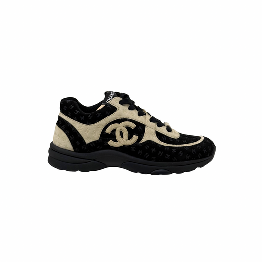 Chanel lace-up sneakers in black and beige with large CC logo and chunky sole
