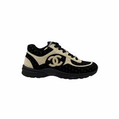 Chanel lace-up sneakers in black and beige with large CC logo and chunky sole