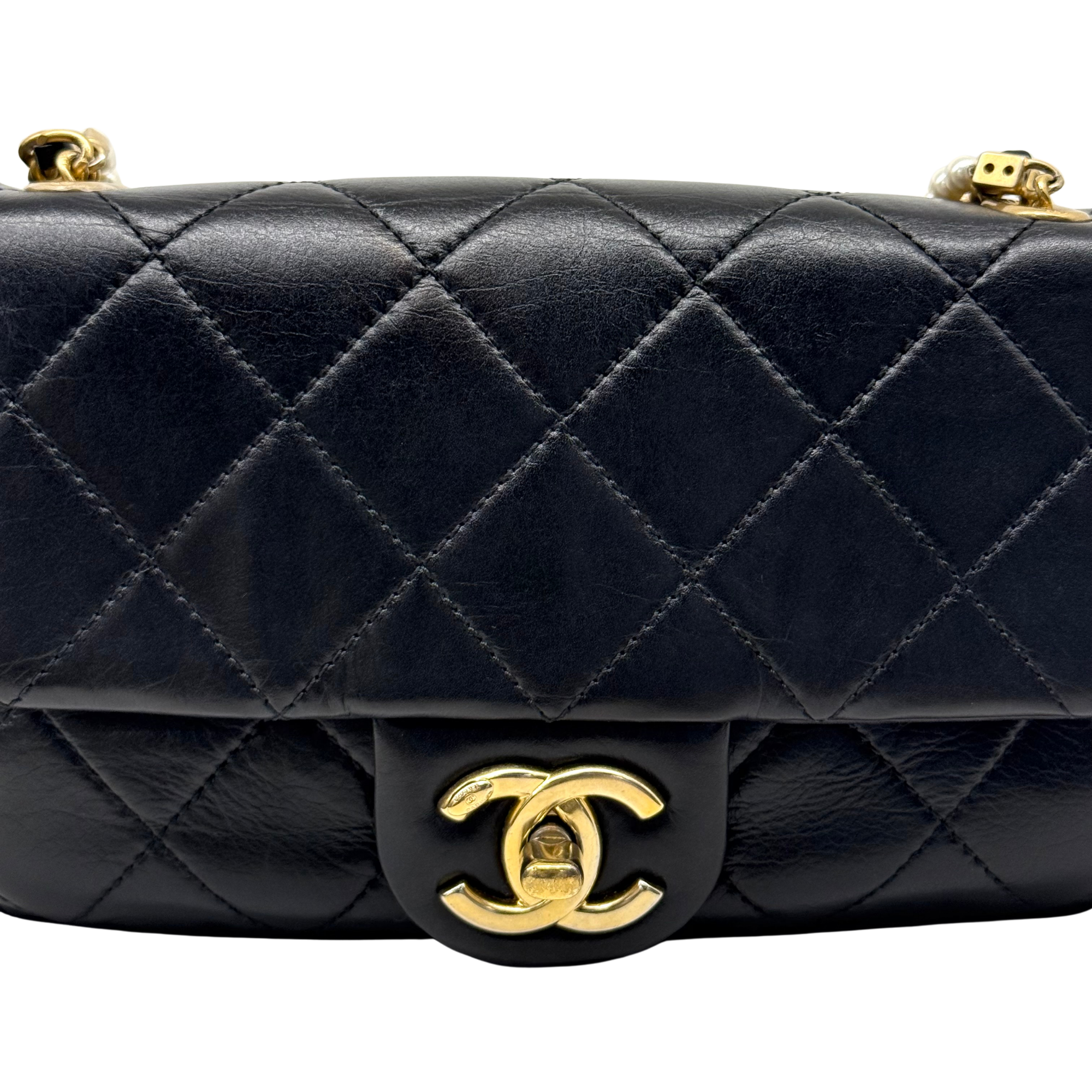 Chanel black bag with pearl strap