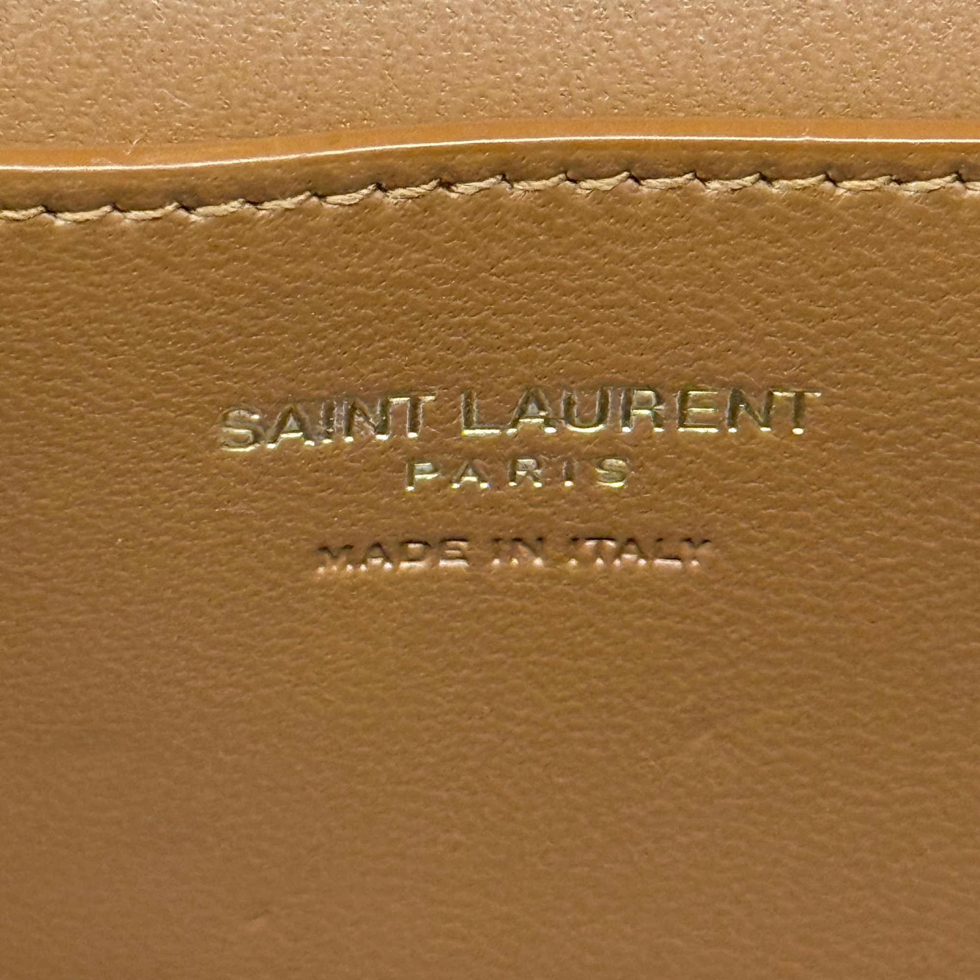 Beige canvas pouch with brown leather trim and Saint Laurent logo embossing