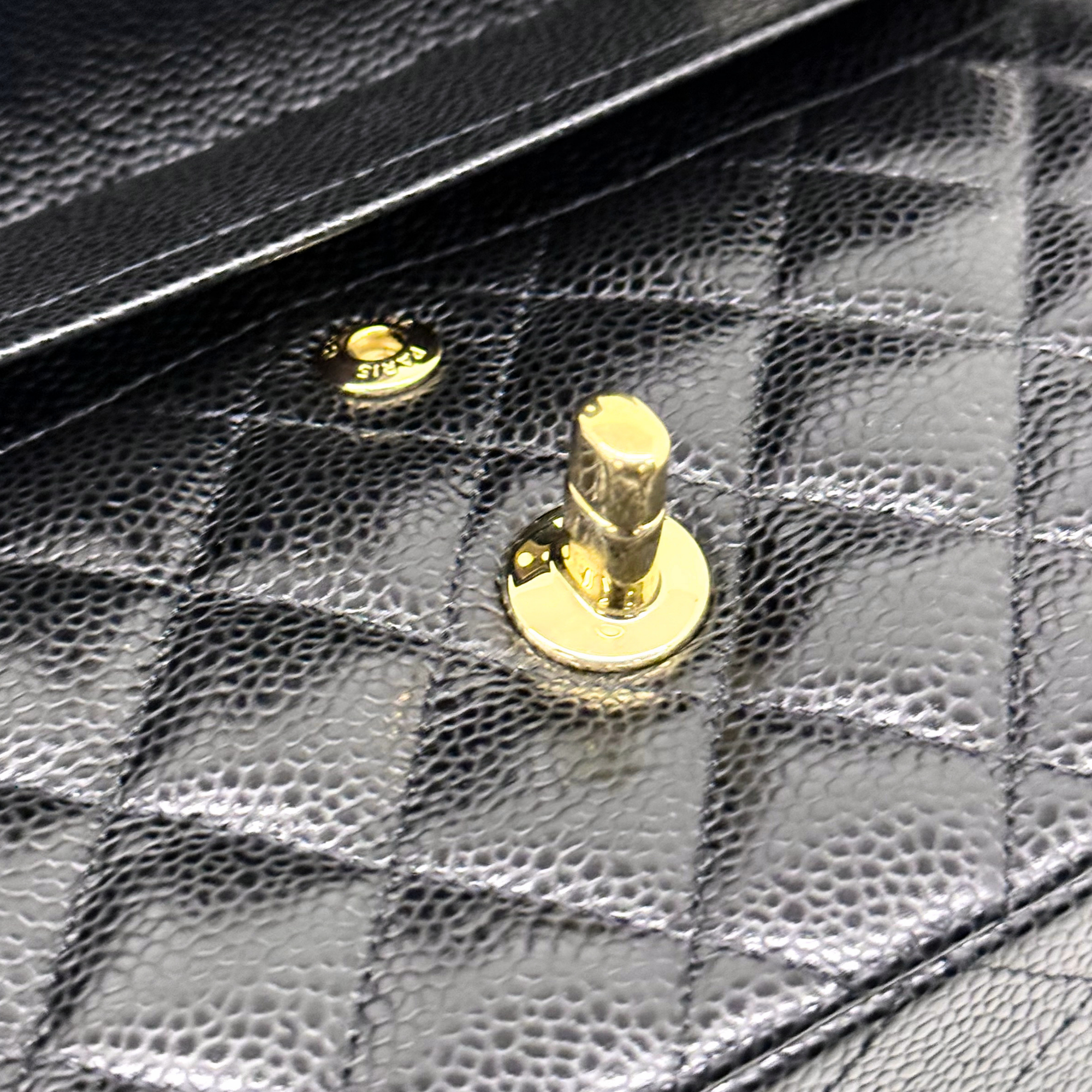 Chanel black bag caviar leather gold hardware