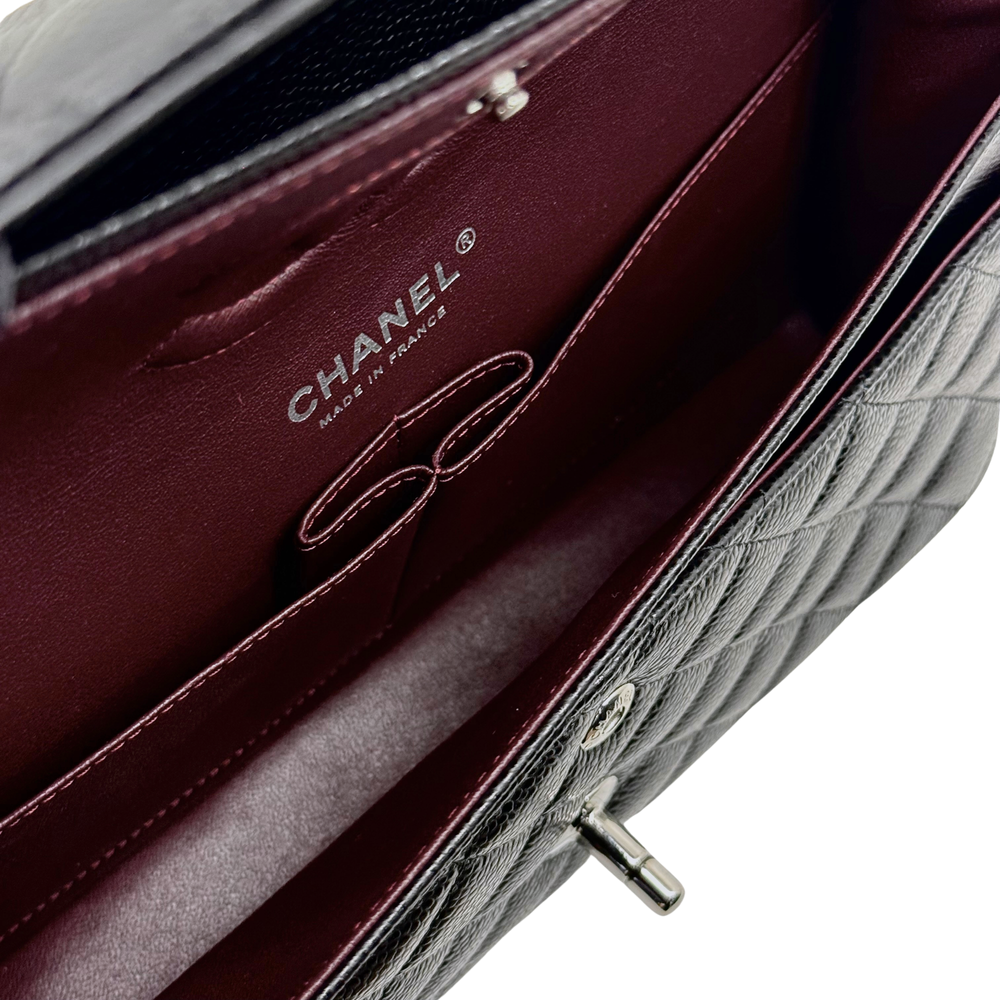 Burgundy interior lining with CHANEL Made in France label and zipper pull