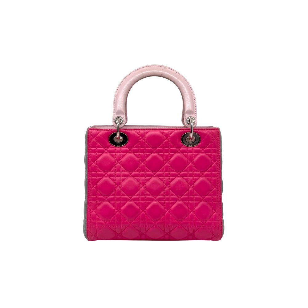 Fuchsia quilted handbag with pink top handles and silver hardware rings