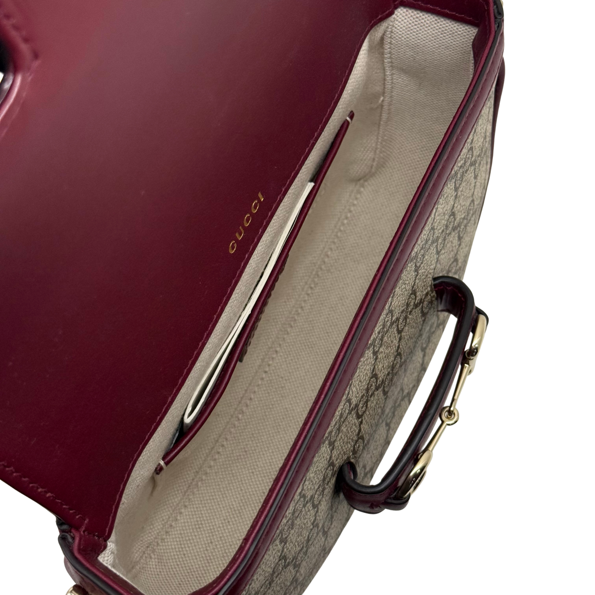 Gucci crossbody bag interior lining in beige canvas with burgundy leather trim