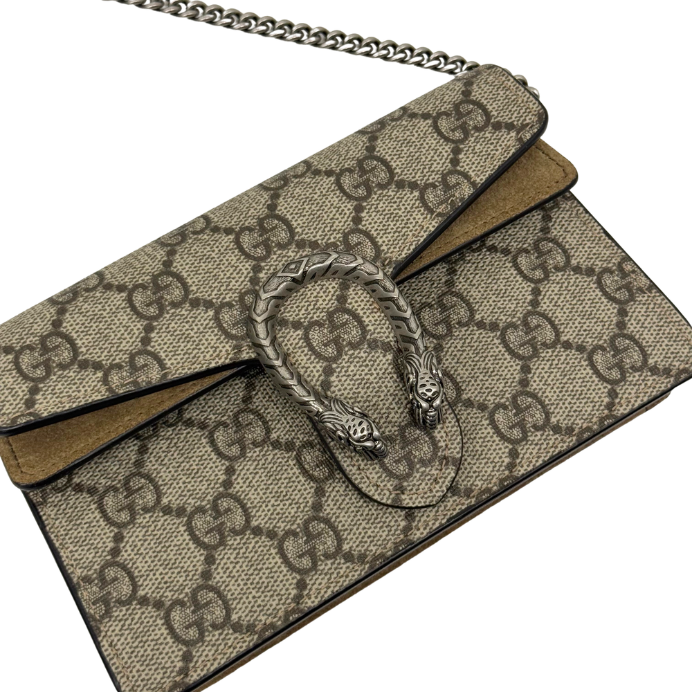 Gucci GG canvas flap with lion-like metal clasp and chain strap