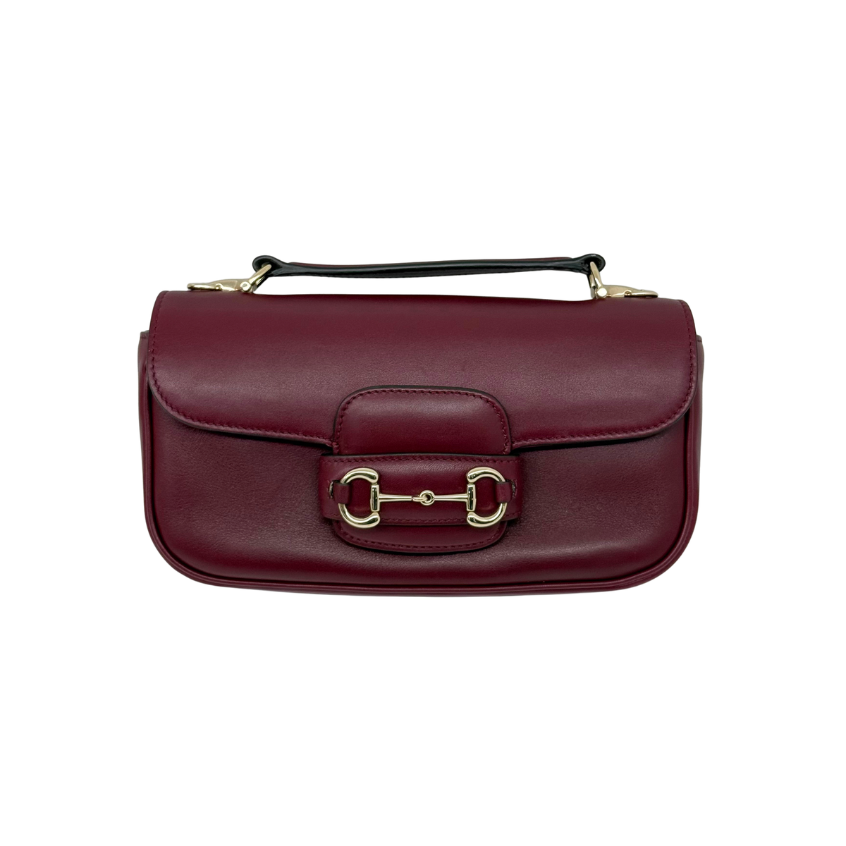 Maroon leather mini shoulder bag with top handle and front clasp
