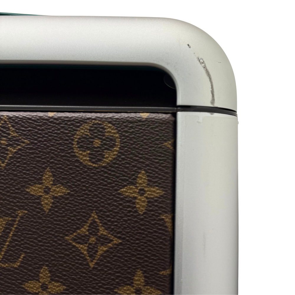 Pre-owned rolling suitcase top corner, white edge and monogram canvas panel