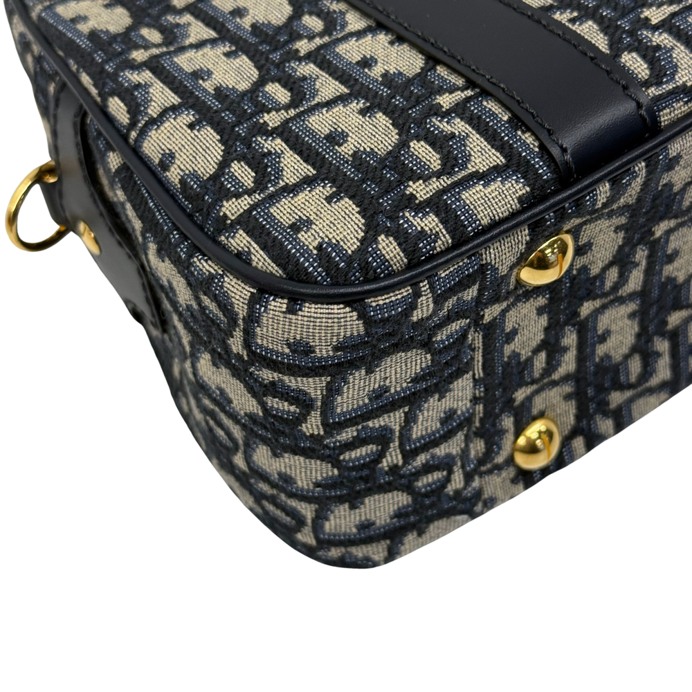 Navy and cream monogram handbag top edge with black leather trim and gold hardware
